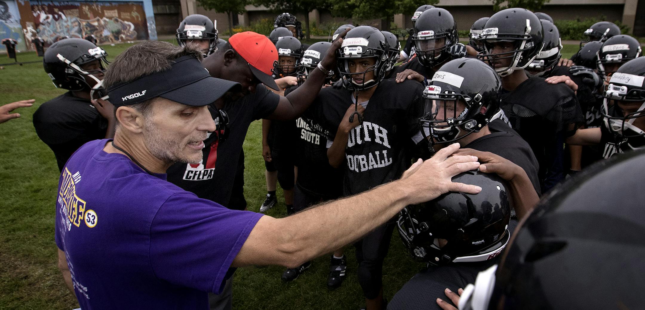 Minneapolis South football coach Rodney Lossow huddled up with his team during a practice. ] CARLOS GONZALEZ ï cgonzalez@startribune.com - August 21, 2017, Minneapolis, MN, Minneapolis South football coach Rodney Lossow, former coaching fixture at Roosevelt.