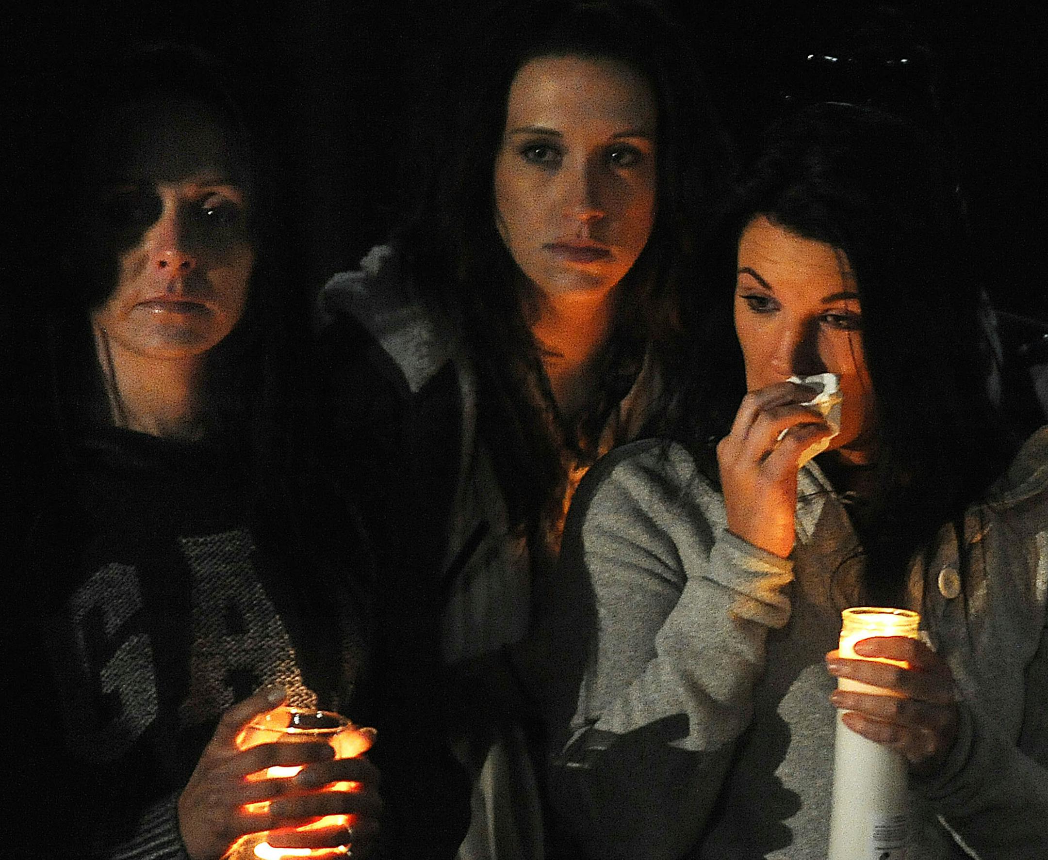 Family, friends and well-wishers gather in Sertoma Park in Sioux Falls, S.D., for a candlelight vigil in memory of Minnesota Vikings' Adrian Peterson's 2-year-old son on Friday, Oct. 11, 2013. Authorities said a 2-year-old boy died Friday of injuries suffered in an alleged child abuse case and a person with knowledge of the situation told The Associated Press the boy was Peterson's son. (AP Photo/Argus Leader, Jay Pickthorn) NO SALES