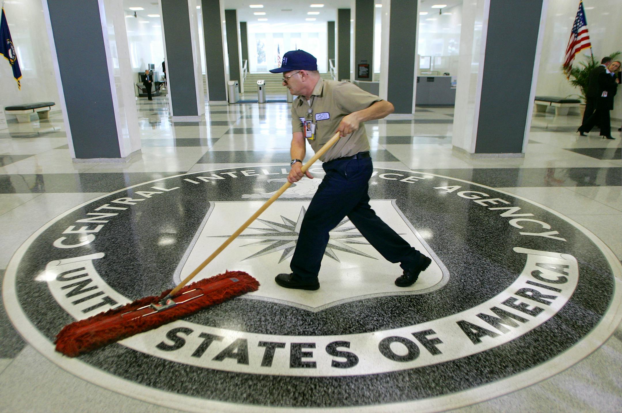 FILE - In this March 3, 2005 file photo, a workman slides a dustmop over the floor at the Central Intelligence Agency headquarters in Langley, Va. President Barack Obama has ordered intelligence officials to conduct a broad review of election-season cyberattacks, including the email hacks that rattled the presidential campaign and raised fresh concerns about Russia's meddling in U.S. elections, the White House said Friday. (AP Photo/J. Scott Applewhite)