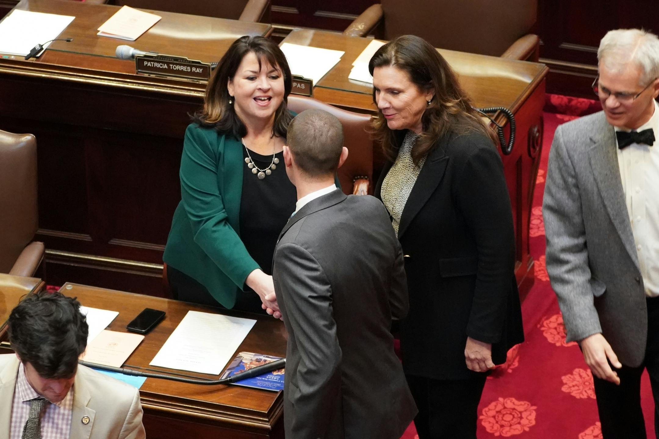 New Senate Minority Leader Sen. Susan Kent, DFL-Woodbury was greeted by Senate President Jeremy Miller, R-Winona, and Sen. Julie Rosen, R-Vernon Center before the start of session.
