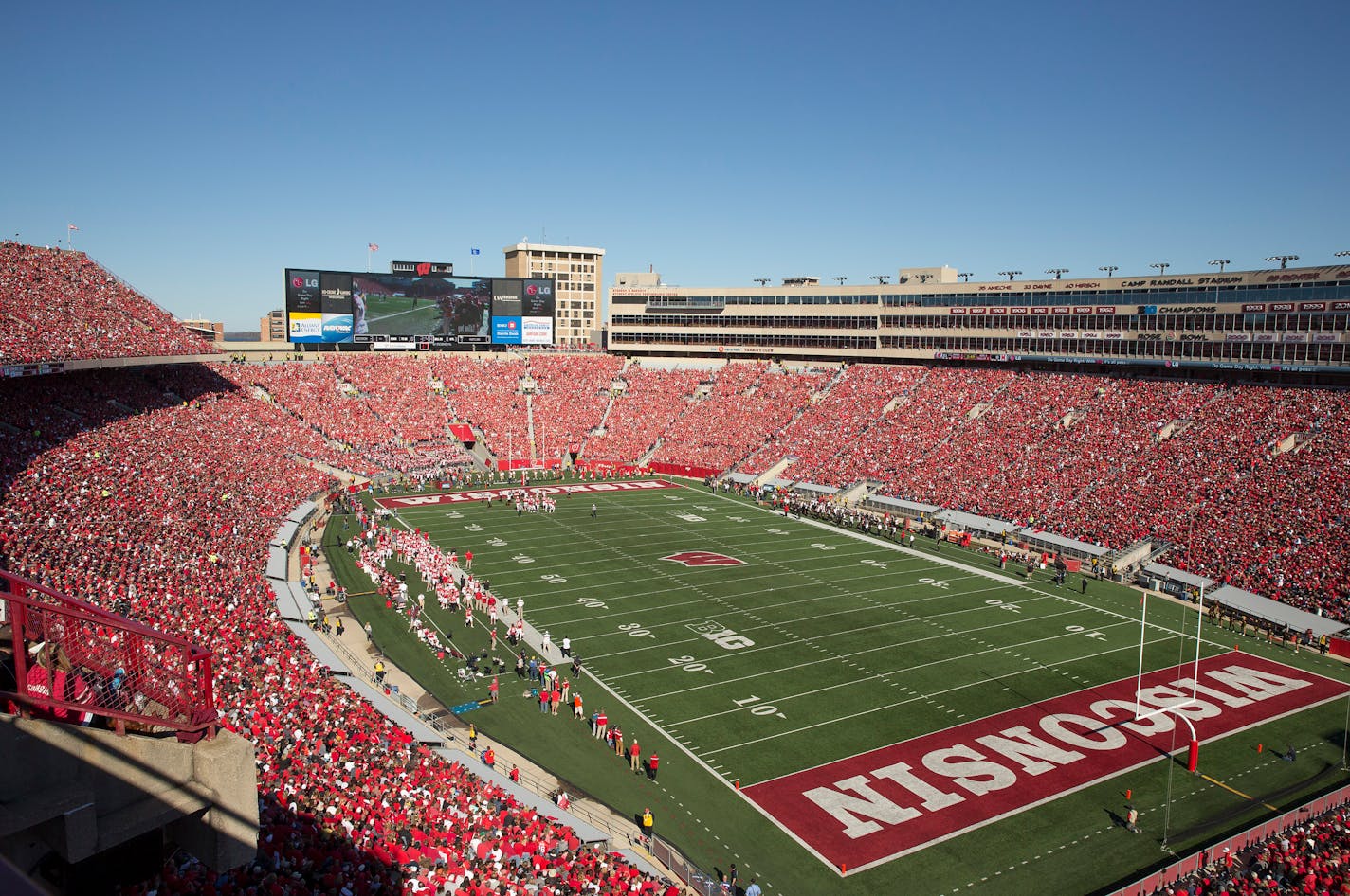 View from upper deck of Camp Randall Stadium showing fans in red Badgers apparel in Madison, Wis.