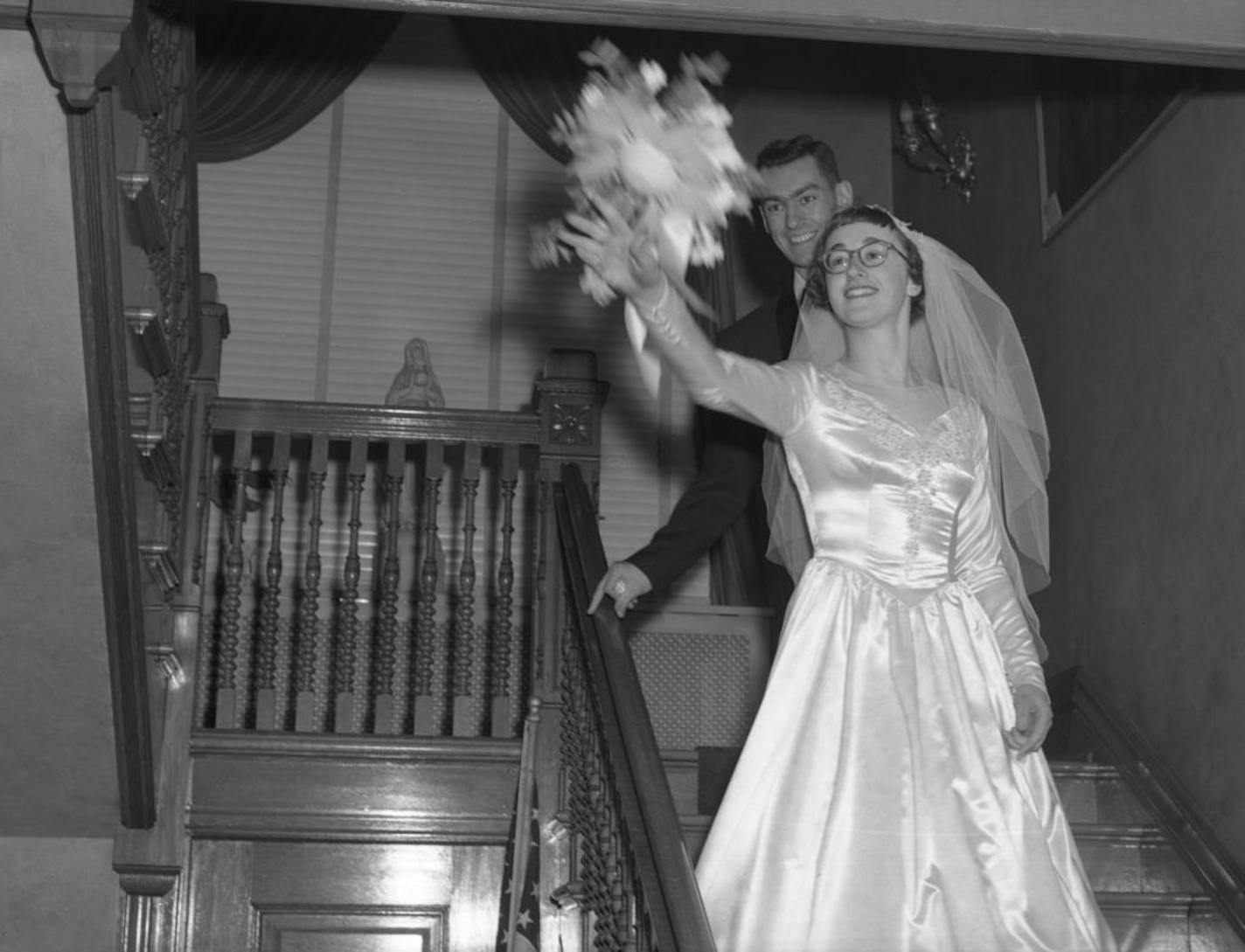 Carole Kenny throws the bouquet at her wedding to William Kenny. The couple were married for 65 years.