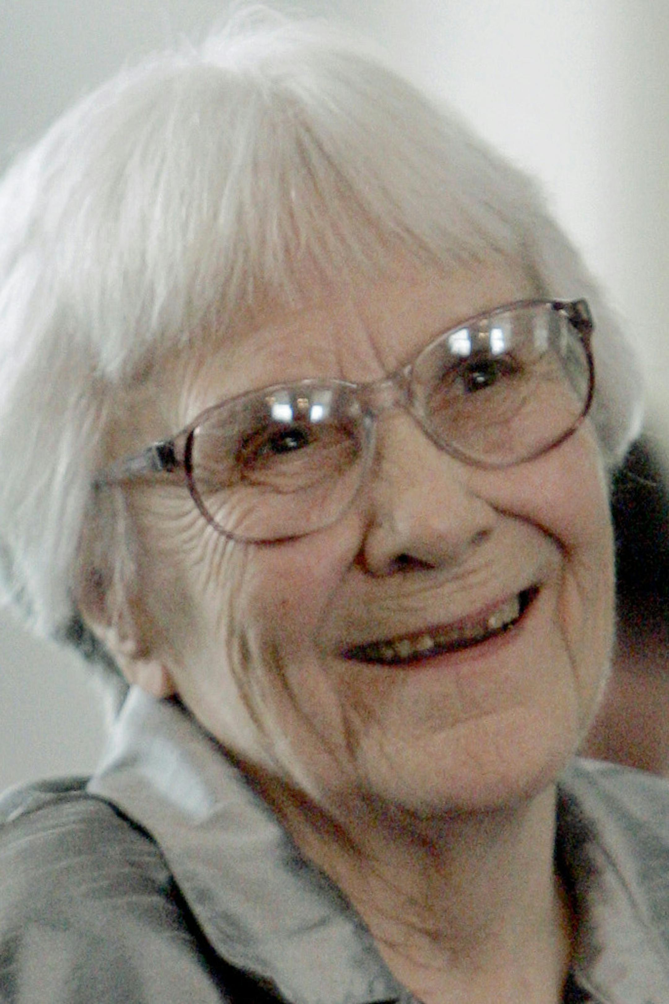 FILE - In this Aug. 20, 2007, file photo, author Harper Lee smiles during a ceremony honoring the four new members of the Alabama Academy of Honor at the Capitol in Montgomery, Ala. Lee, elusive author of best-seller "To Kill a Mockingbird," has died at 89, according to her publisher Harper Collins. (AP Photo/Rob Carr, File) ORG XMIT: MIN2016022511475933