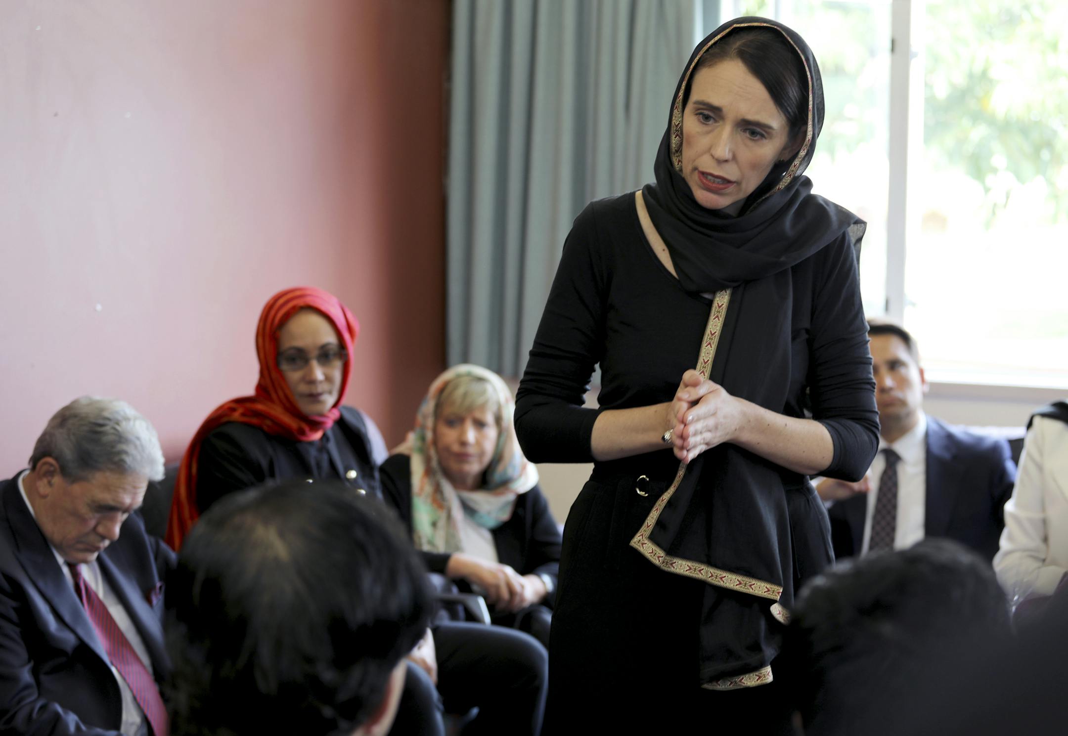 In this photo released by New Zealand Prime Minister's Office, Prime Minister Jacinda Ardern speaks to representatives of the Muslim community, Saturday, March 16, 2019 at the Canterbury Refugee Centre in Christchurch, New Zealand, a day after the mass shootings at two mosques in the city. (New Zealand Prime Minister Office via AP)
