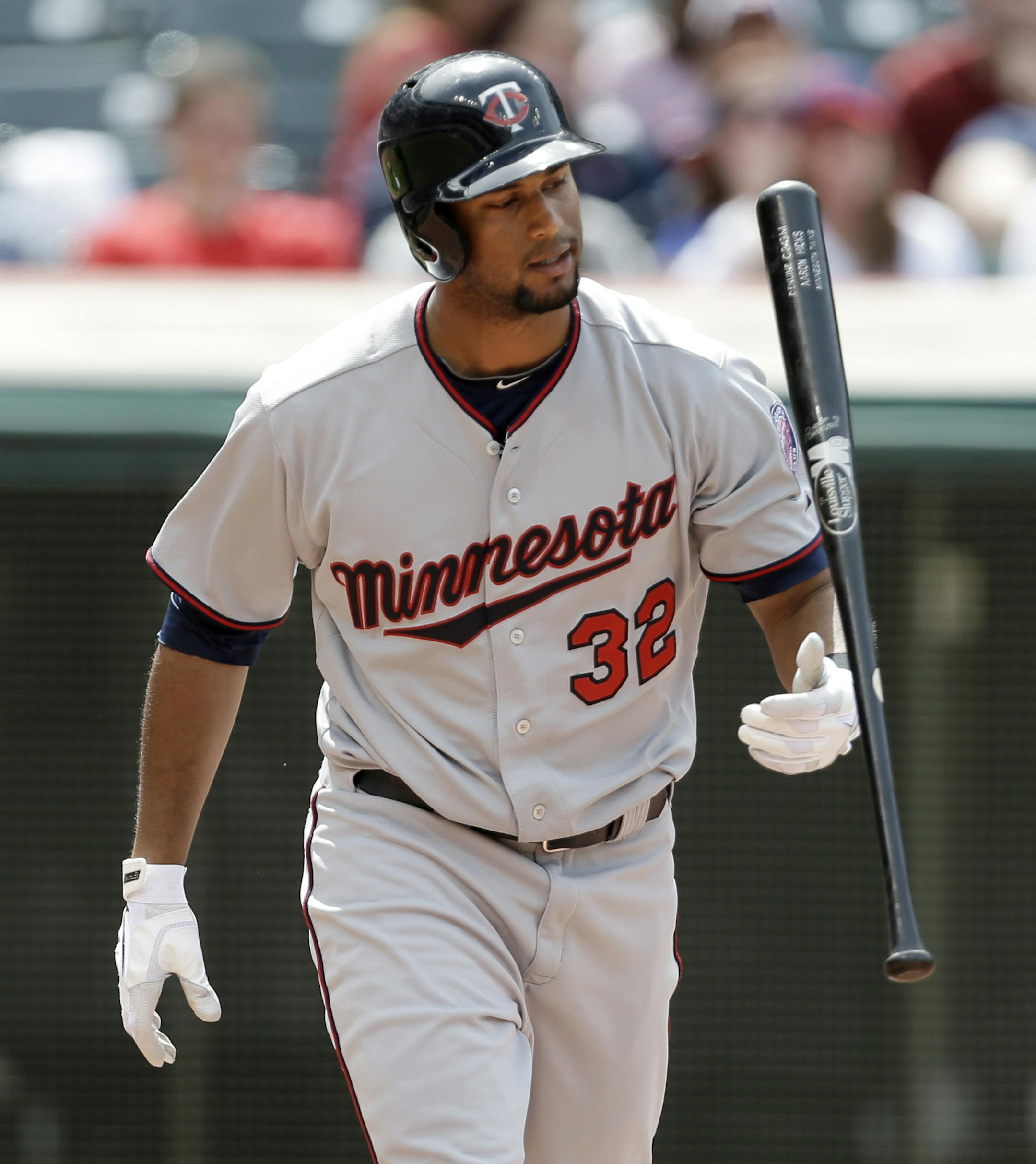 Minnesota Twins' Aaron Hicks tosses hit bat after striking out against Cleveland Indians relief pitcher Bryan Shaw in the seventh inning of a baseball game, Saturday, May 4, 2013, in Cleveland. The Indians won 7-3. (AP Photo/Tony Dejak) ORG XMIT: MIN2013050417295662