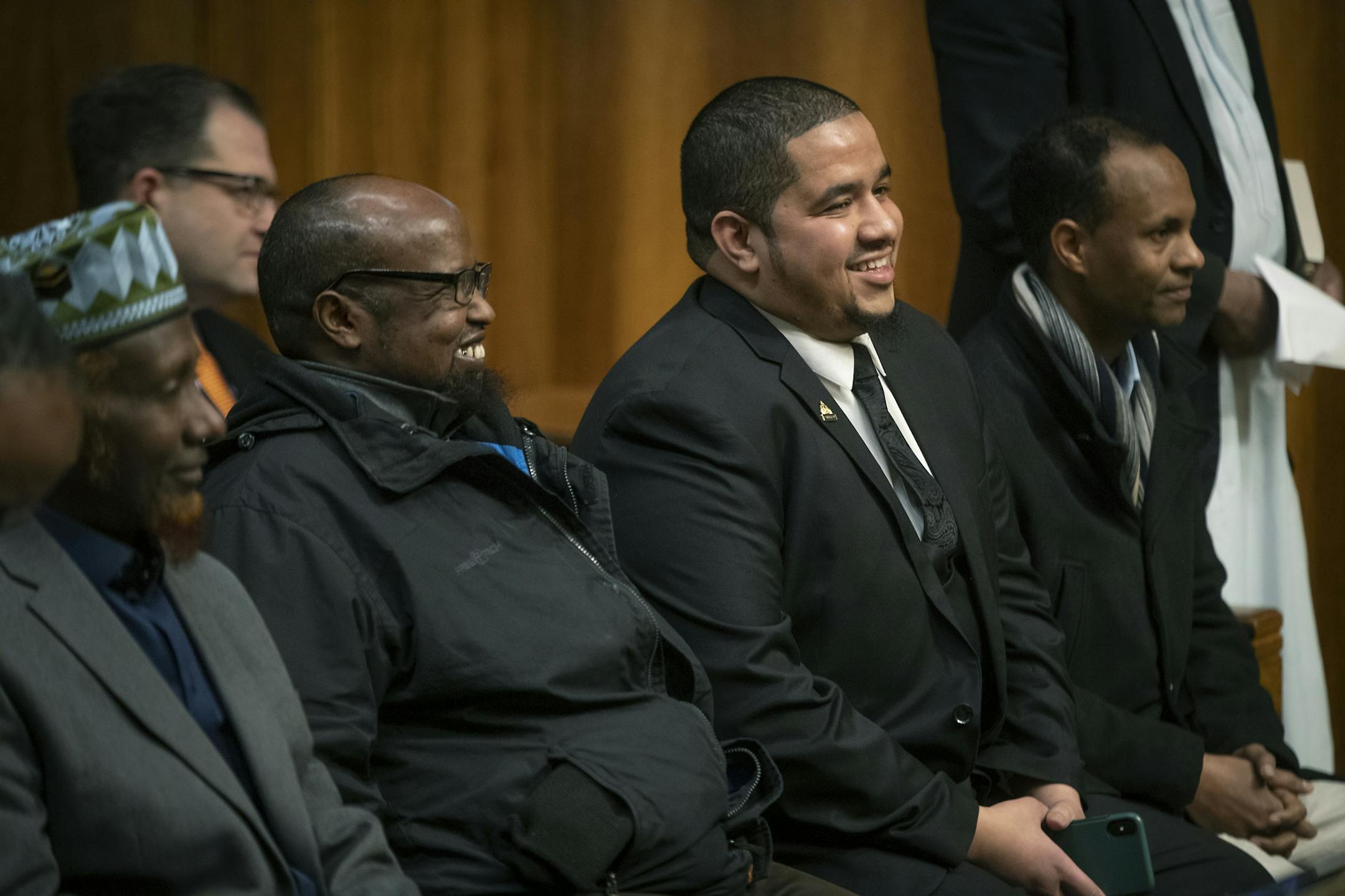 City Council Member Kassim Busuri and his supporters laughed as St. Paul Mayor Melvin Carter addressed the small crowd before he was sworn in at St. Paul City Hall, Wednesday, February 6, 2019 in St. Paul, MN. Busuri, a local educator, is the first Somali-American to serve on the St. Paul City Council.