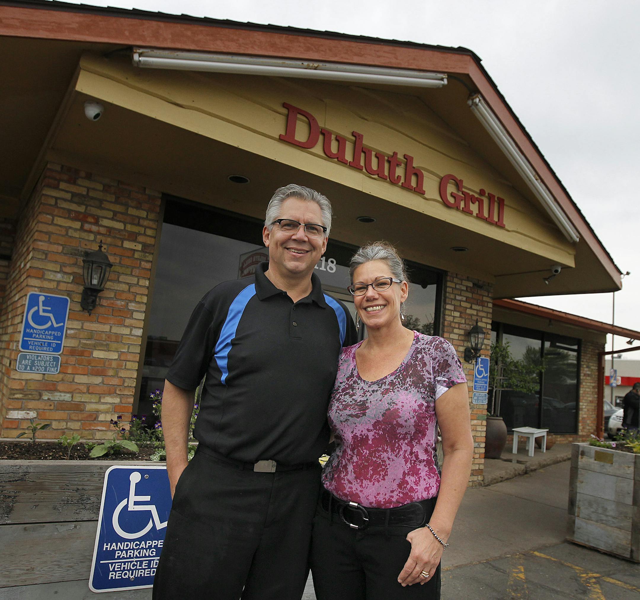 Duluth Grill owners Tom and Jama Hanson are proud of their raised bed gardens in their parking lot, Thursday, June 20, 2013 in Duluth, MN. (ELIZABETH FLORES/STAR TRIBUNE) ELIZABETH FLORES • eflores@startribune.com