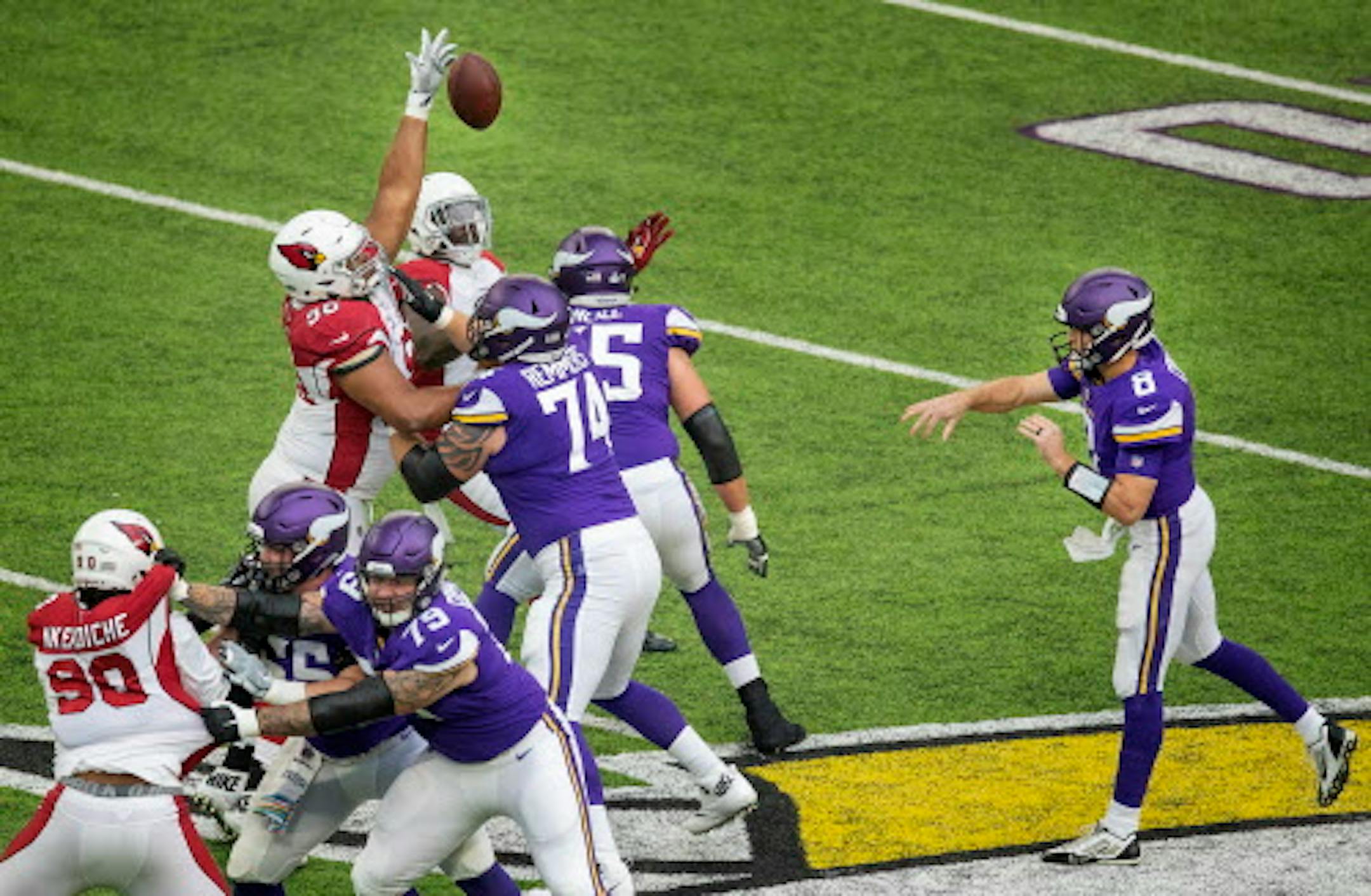 Minnesota Vikings quarterback Kirk Cousins had a pass batted down which he caught and ran with in the first quarter.