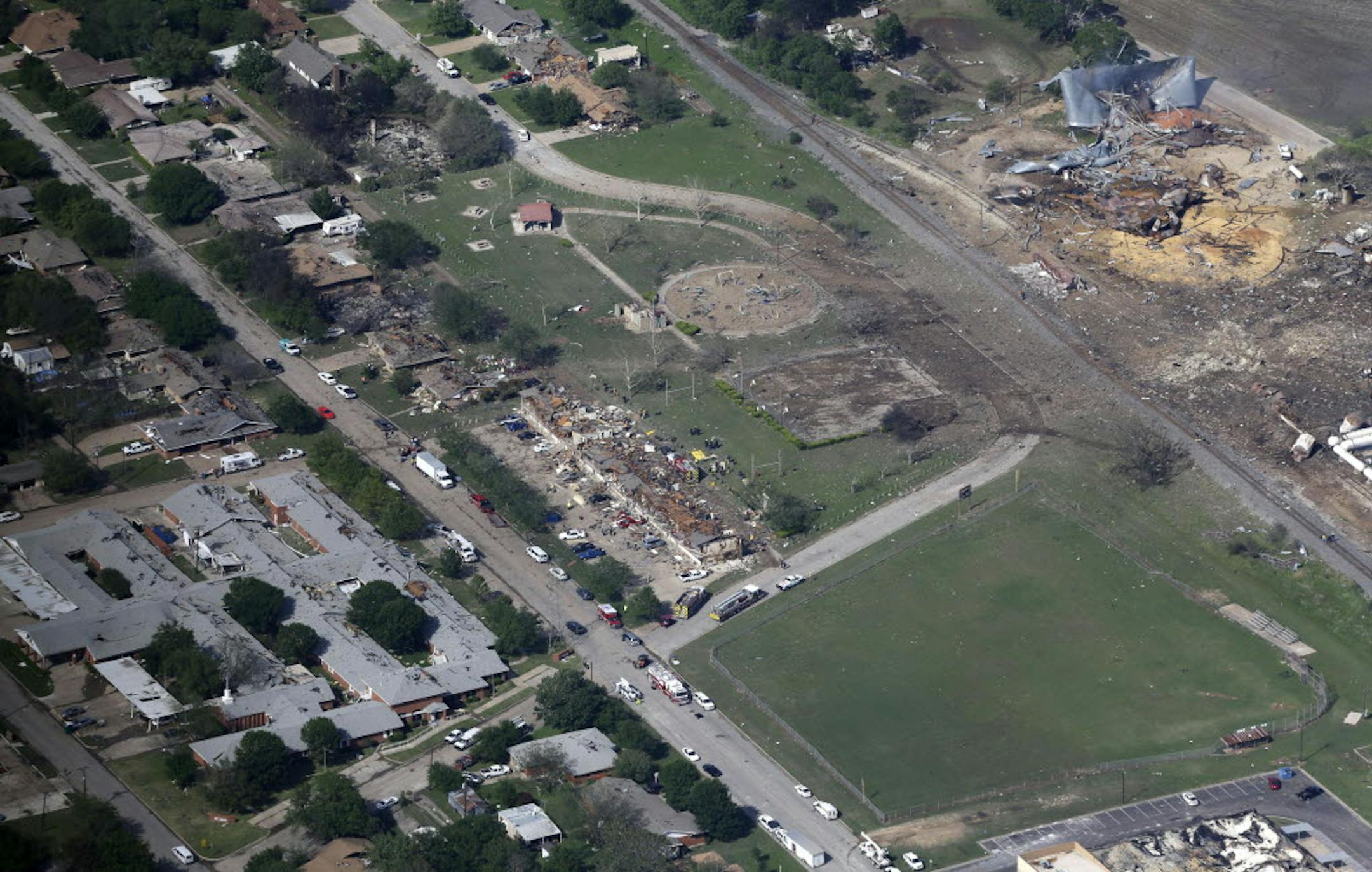 This aerial photo shows the remains of a nursing home, left, apartment complex, center, and fertilizer plant, right, destroyed by an explosion in West, Texas.