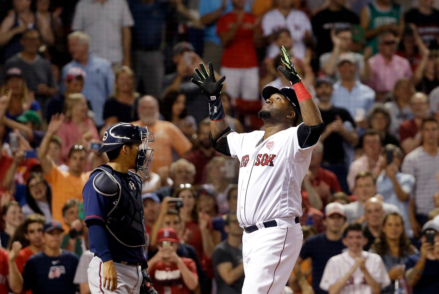 Boston Red Sox designated hitter David Ortiz gestures at the plate in front of Minnesota Twins catcher Kurt Suzuki after hitting a two-run homer in the eighth inning of a baseball game at Fenway Park, Thursday, July 21, 2016, in Boston. (AP Photo/Elise Amendola)