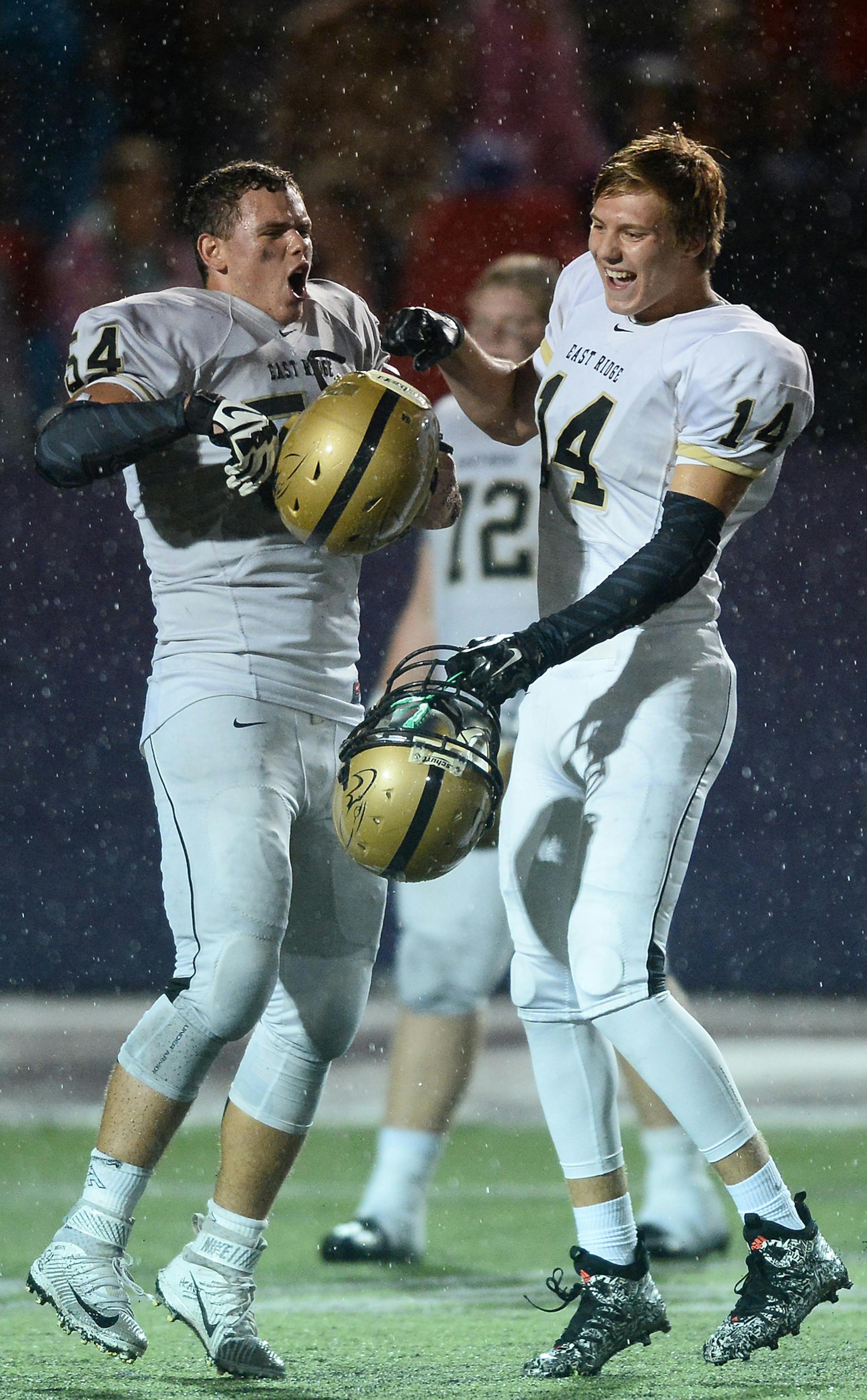 East Ridge lineman Brock Albrecht (54) and tight end Ben Arndt (14) celebrated their team's 35-20 victory over Cretin-Derham Hall Friday night. ] Aaron Lavinsky • aaron.lavinsky@startribune.com East Ridge played Cretin-Derham Hall on Friday, Sept. 18, 2015 at the University of St. Thomas in St. Paul.