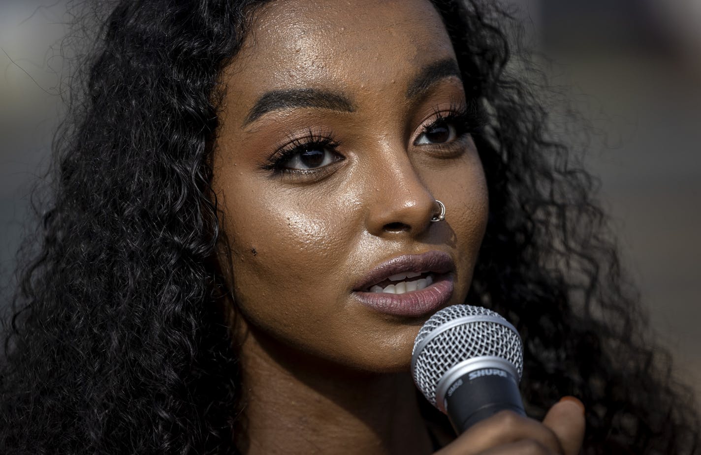 Sumaya Aden spoke at rally & march to honor Isak Aden and Somali Independence Day that began near Twin Cities Premium Outlets in Eagan. Sumaya is the sister of Isak Aden.