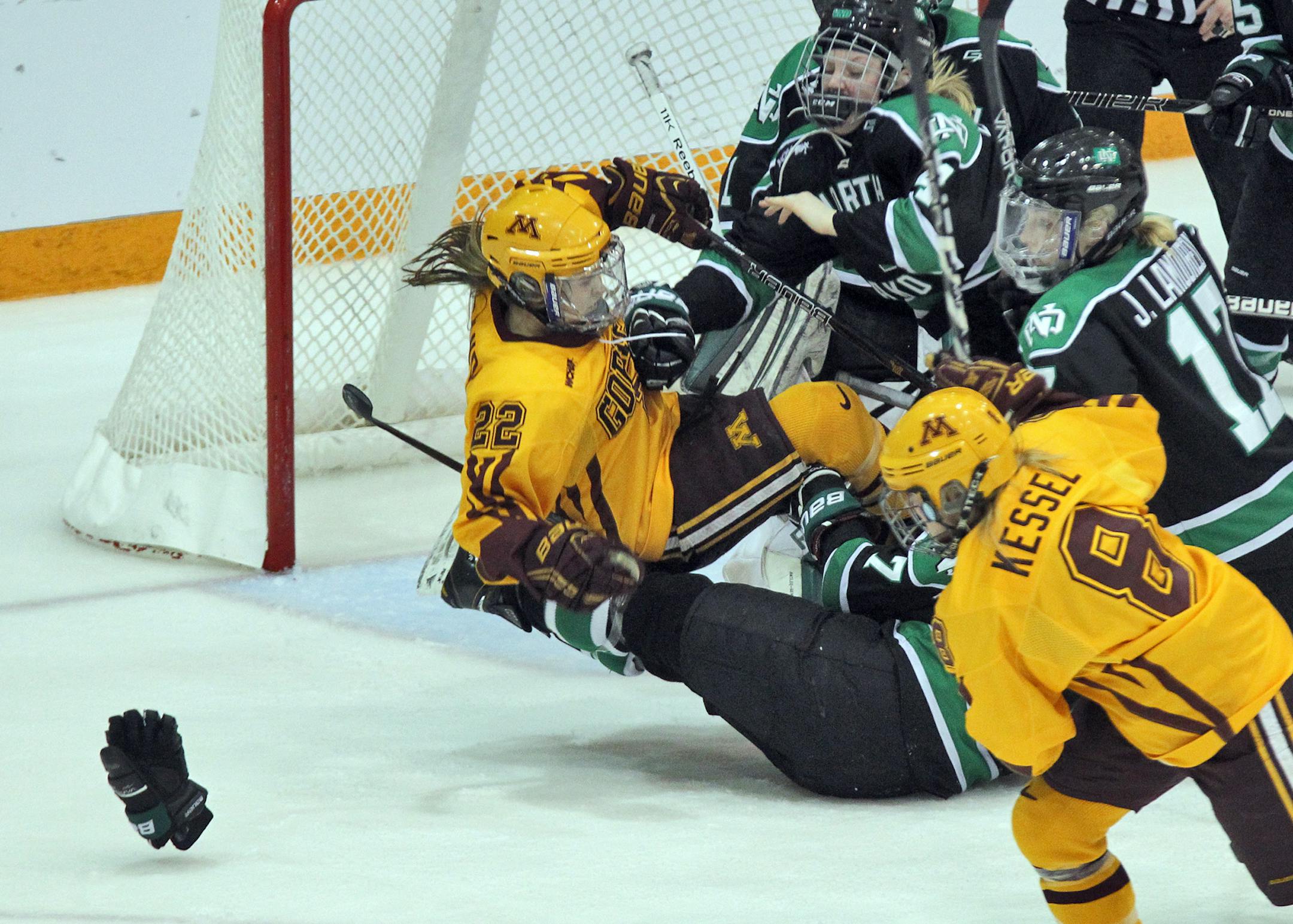 WCHA WOMEN'S HOCKEY CHAMPIONSHIP - Minnesota Gophers vs. University of North Dakota (UND). It was physical game in front of the nets as Gophers Hannah Brandt experienced in 2nd period action. (MARLIN LEVISON/STARTRIBUNE(mlevison@startribune.com (cq -PROGRAM)