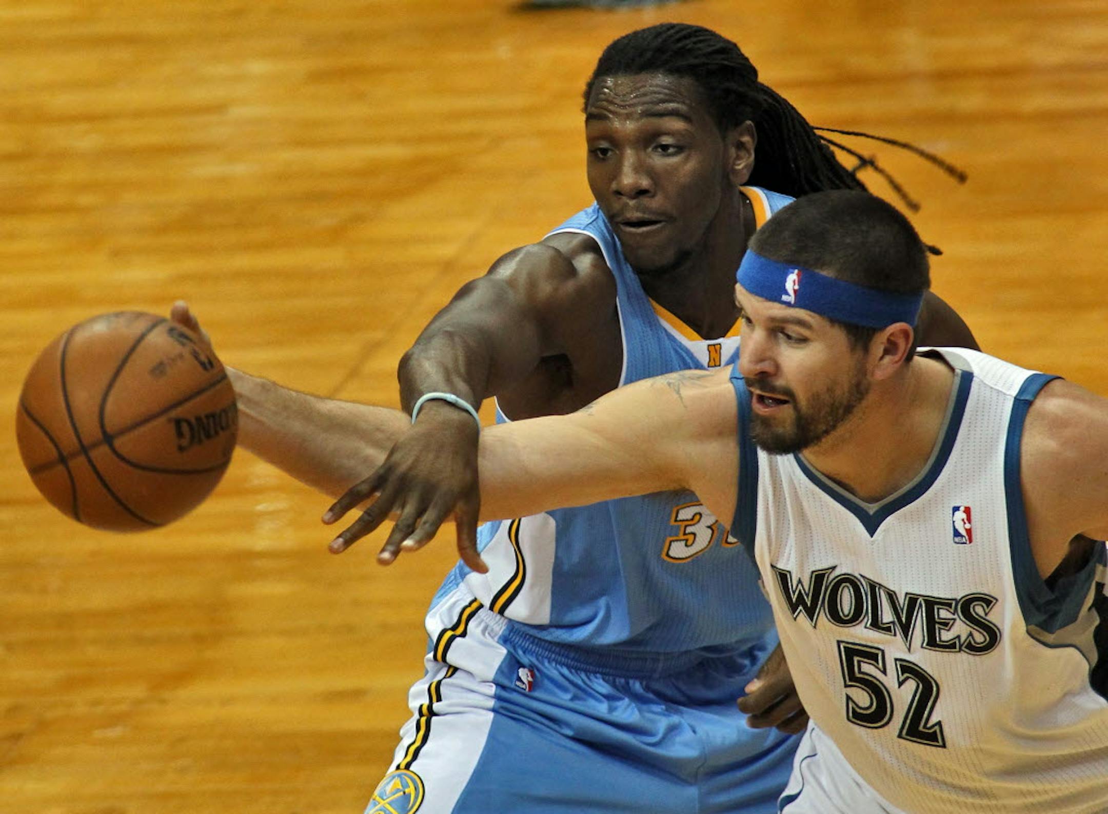 Denver's Kenneth Faried fouled Minnesota's Brad Miller.