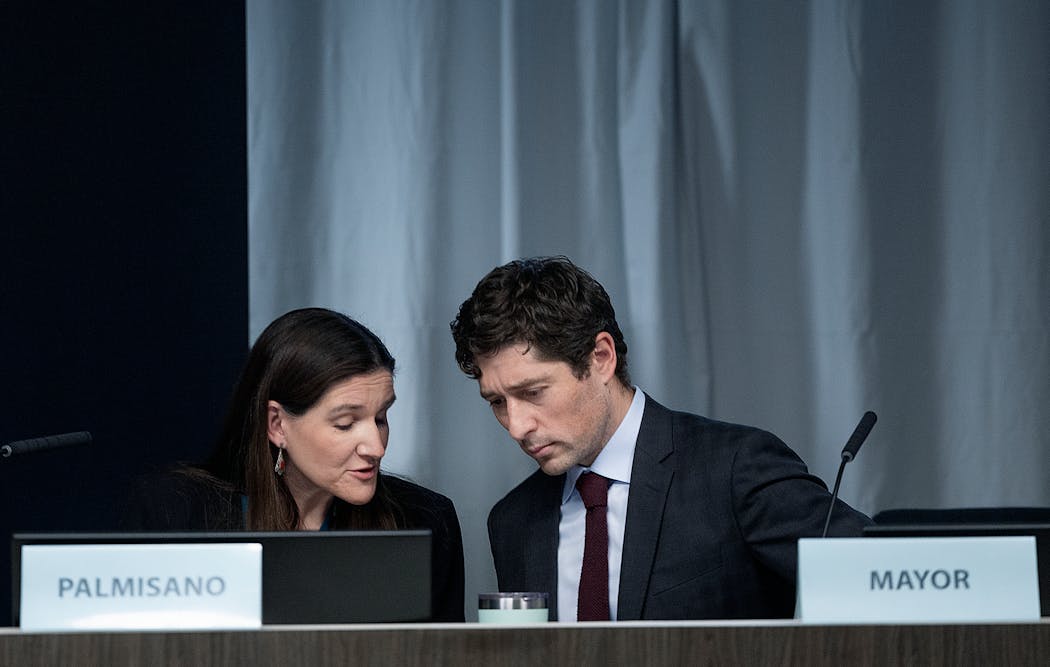 Minneapolis Mayor Jacob Frey and City Council Member Linea Palmisano talked as the council voted on a “Passage of Resolution supporting a permanent ceasefire and preventing loss of human life in the Middle East,” in Minneapolis on Thursday.