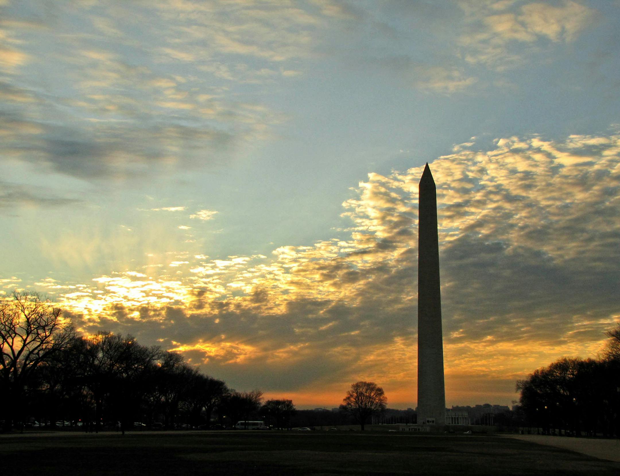 The Washington Monument pierces the sky at twilight.