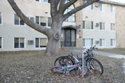 Kids’ bikes were parked outside one of Perspectives’ five apartment buildings after school. Despite the sudden loss of programs, dozens of women a