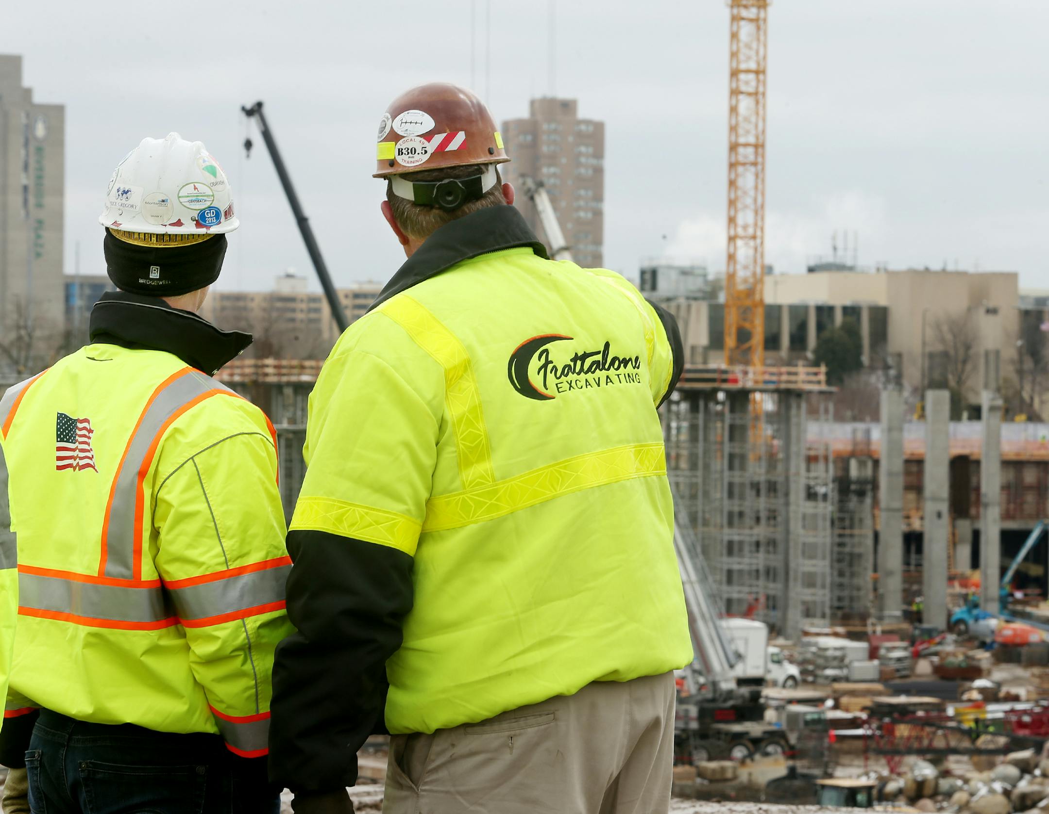 Operations Manager Justin Gaberialson of Ames Construction (left) and Project Supervisor Mark Krause of Frattalone Excavating look over the site of the new Vikings stadium. ] JOELKOYAMA‚Ä¢jkoyama@startribune Minneapolis, MN on April 17, 2014. Demolition of the Hubert H. Humphrey Metrodome has been completed one month ahead of schedule.