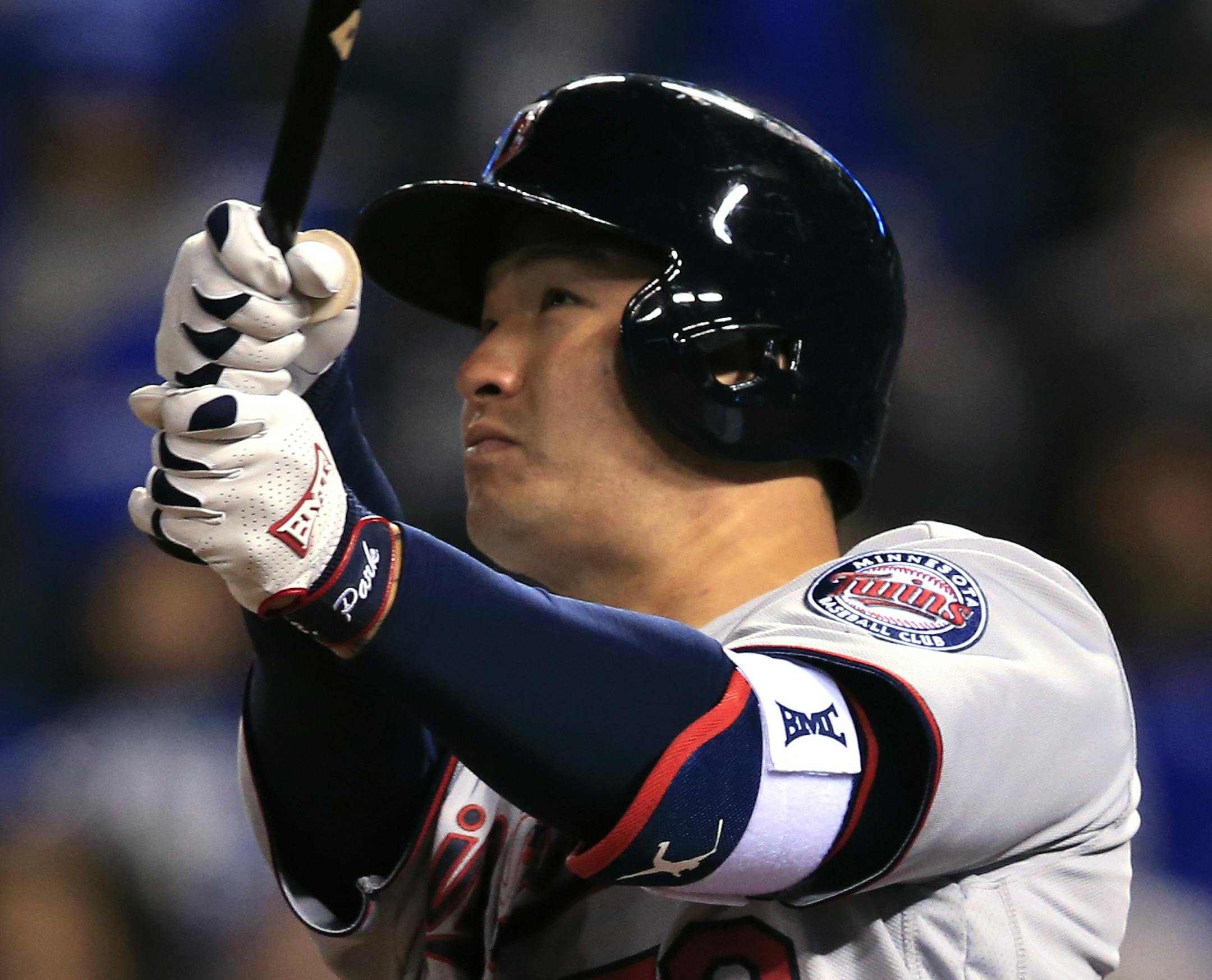 Minnesota Twins' Byung Ho Park watches a solo home run off Kansas City Royals relief pitcher Joakim Soria during the eighth inning of a baseball game at Kauffman Stadium in Kansas City, Mo., Friday, April 8, 2016. (AP Photo/Orlin Wagner)