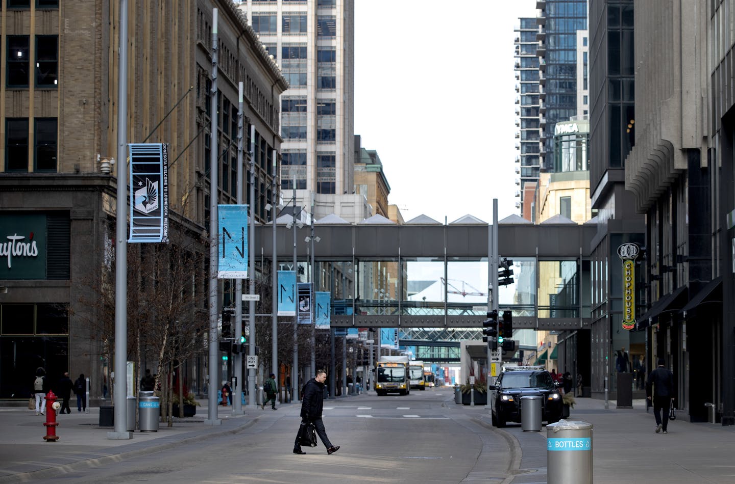 A normally busy Nicollet Mall in downtown Minneapolis had much less pedestrian traffic on Tuesday. ] CARLOS GONZALEZ • cgonzalez@startribune.com – Minneapolis MN – March 17, 2020, Metro Transit will suspend service of all bus and light-rail service between 11 p.m. and 4:30 a.m. beginning Tuesday,