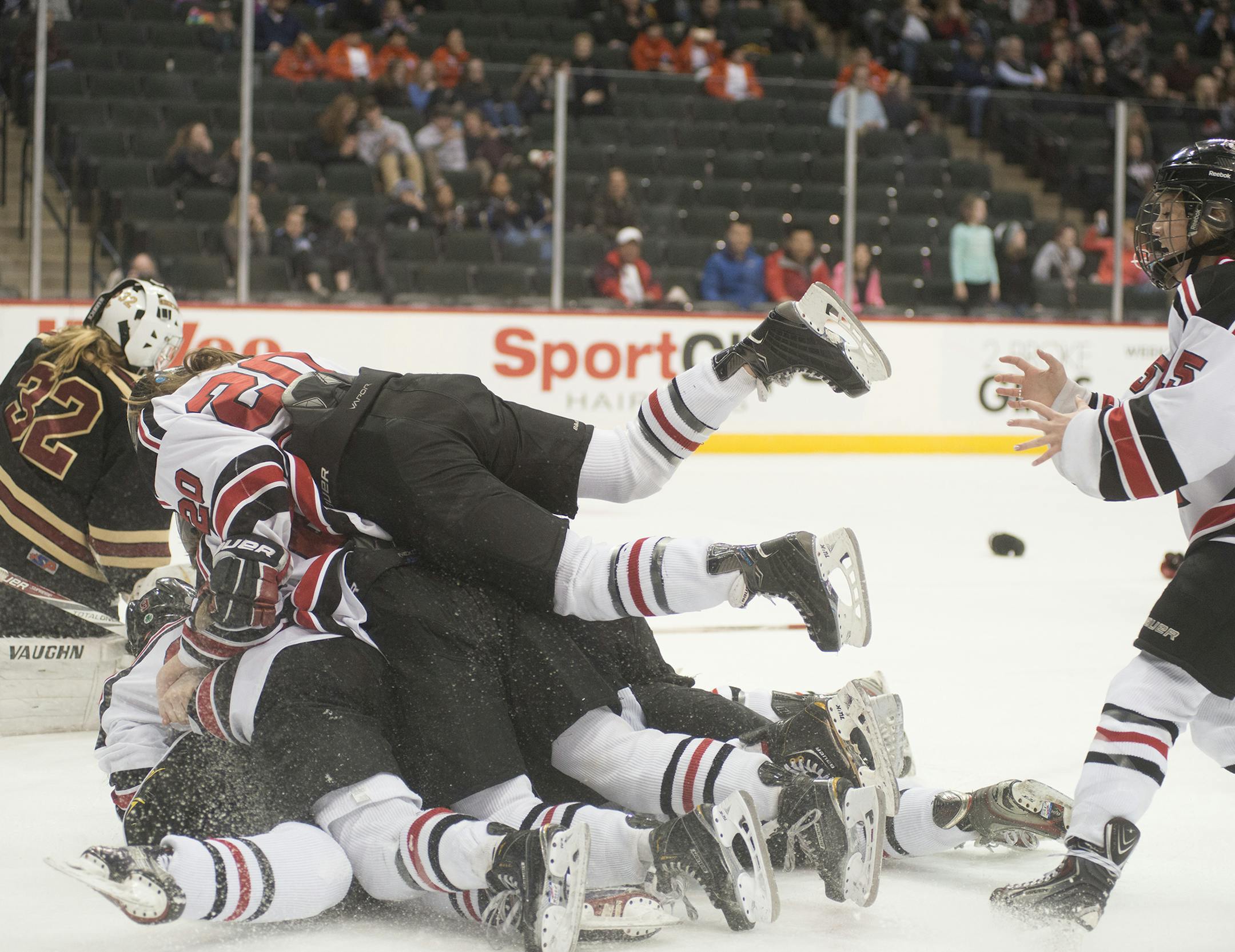 Eden Prairie rushes the rink after winning the Girls' Class 2A State Hockey Championship in overtime, Feb. 20, 2016, at the Xcel Energy Center in St. Paul, MN. ] (Matthew Hintz, 022016, St. Paul)
