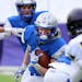 Owatonna running back Jason Williamson (22) looks for running room during a long second half against Chaska during their State Class 5A football playo