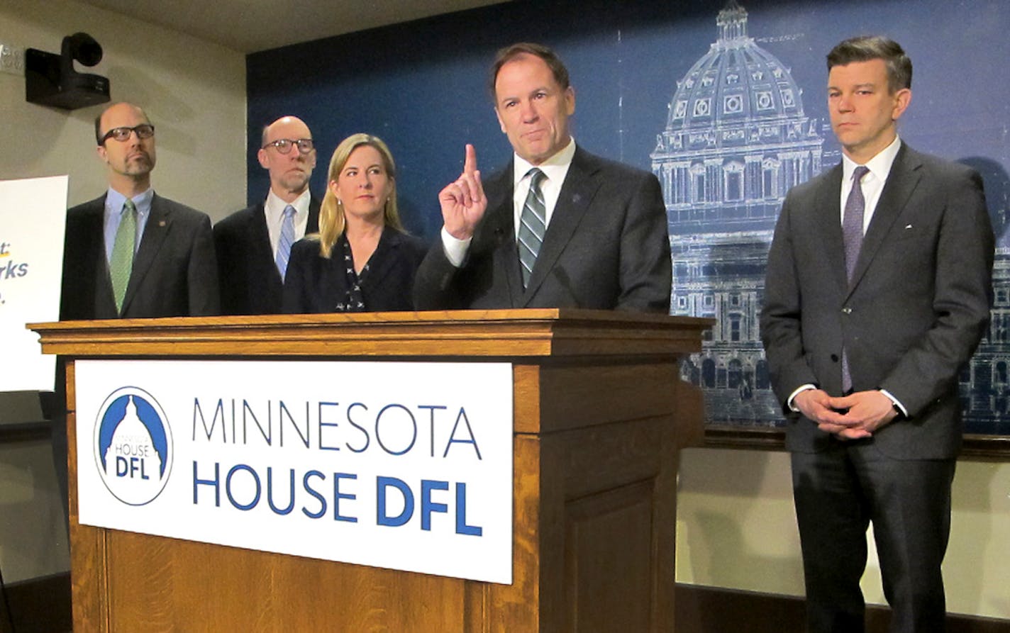 Minnesota House Tax Committee Chairman Paul Marquart, second from right, presents the House Democratic tax bill at a news conference at the state Capitol on Monday, April 8, 2019, in St. Paul, Minn. Joining MarquartI for the presentation from left are, Reps. Dave Pinto and Jim Davnie, House Speaker Melissa Hortman, Marquart, and House Majority Leader Ryan Winkler. (AP Photo/Steve Karnowski)