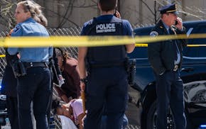 Bystanders react to a homicide on April 30 in south Minneapolis.