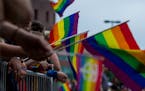 Attendees hold pride flags along the parade route. ] NICOLE NERI &#xa5; nicole.neri@startribune.com
BACKGROUND INFORMATION: Sunday June 23, 2019 at th