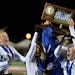 Eagan teammates celebrate their Class 2A championship following their 1-0 victory over Eden Prairie names them the 2014 Class 2A Girls champions. ] (S