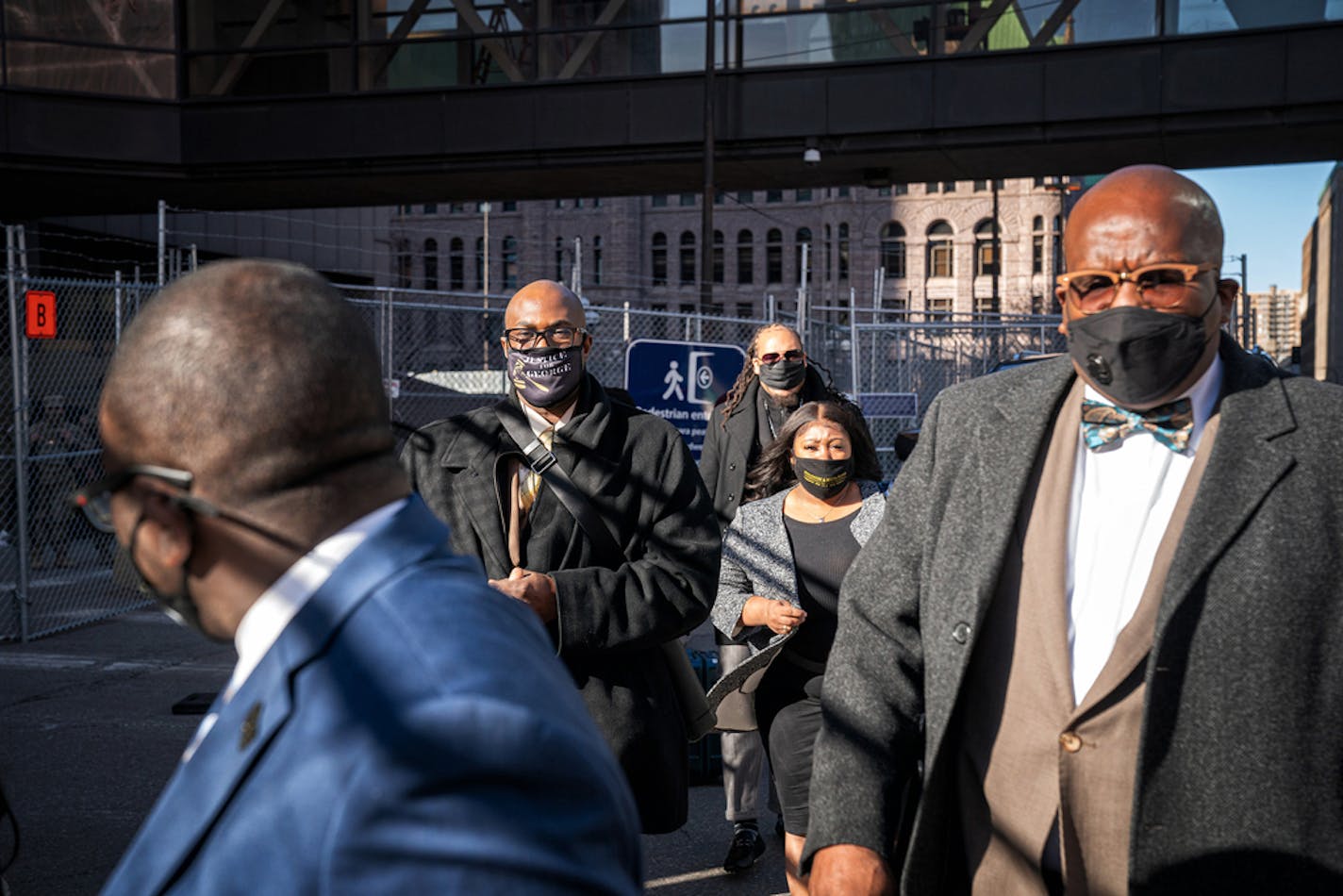 Family and supporters of George Floyd, including brother Philonise Floyd, left, outside the Hennepin County Courthouse at the end of the fourth day of proceedings at Derek Chauvin's trial in Floyd's death, Thursday, April 1, 2021, in Minneapolis. (Glen Stubbe/Minneapolis Star Tribune/TNS) ORG XMIT: 12640964W