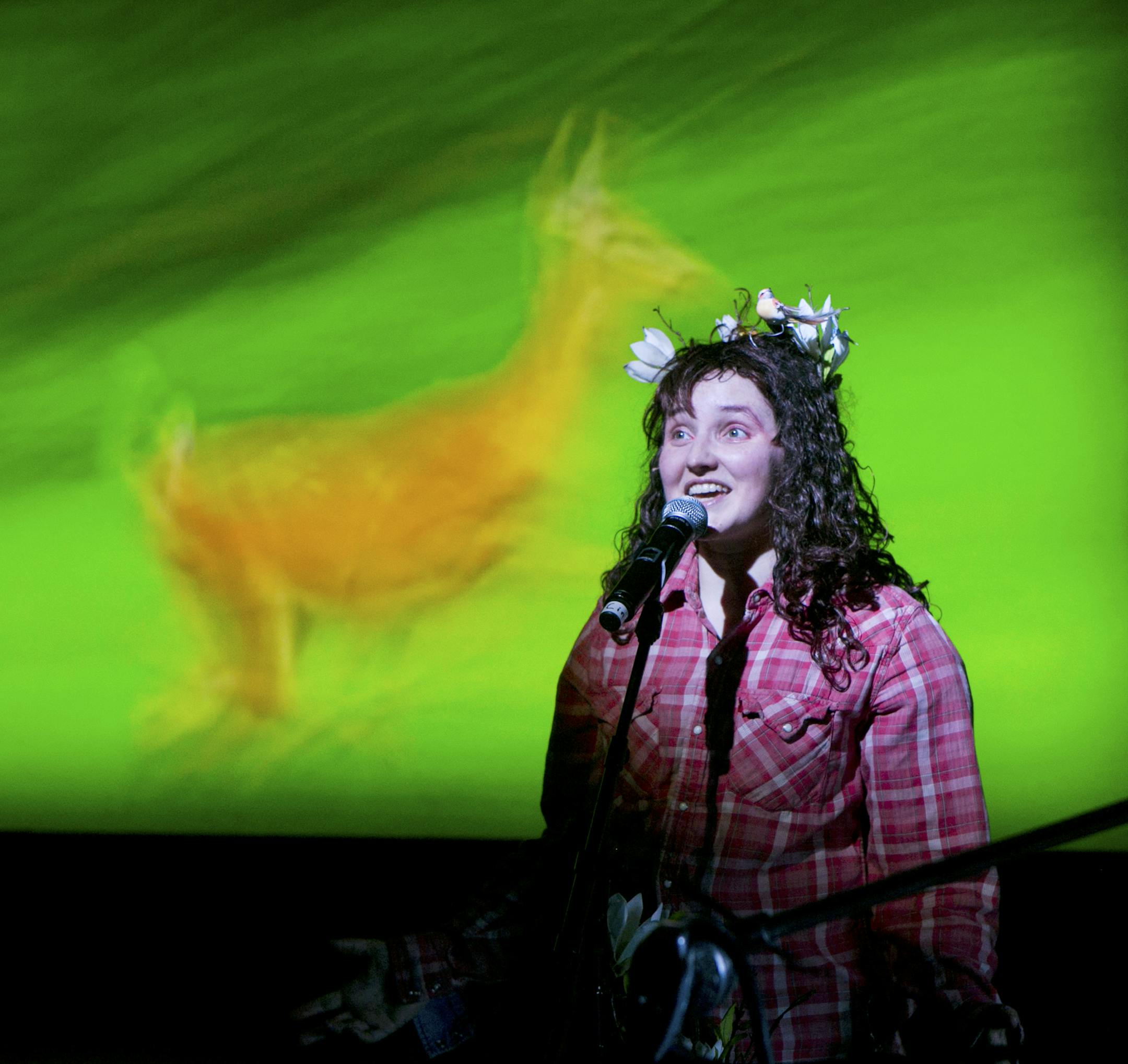 The writer-performer Cynthia Hopkins in her play "This Clement World" at St. Ann's Warehouse in New York, Feb. 4, 2013. The show, which includes original songs and video footage that she shot during a three-week Arctic expedition, is a singing sermon preaching the evils of global warming. (Sara Krulwich/The New York Times) ORG XMIT: MIN2013022516052946