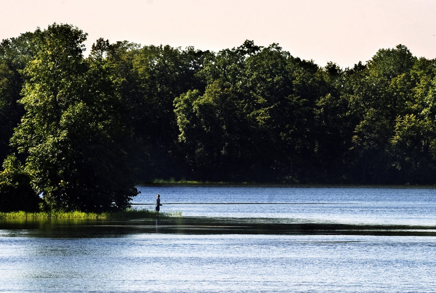 DAVID BREWSTER &#xef; dbrewster@startribune.com Tuesday 08/17/10 Prior Lake The large west suburban park district which at one time was known as Hennepin Parks is looking to expand its empire by taking over operation of Scott County Parks -without adding taxing authority in Scott County. Looking at what's in it for the Hennepin County taxpayer. IN THIS PHOTO: Fishing on Cleary Lake in Prior Lake Tuesday afternoon. ORG XMIT: MIN2013090219584567