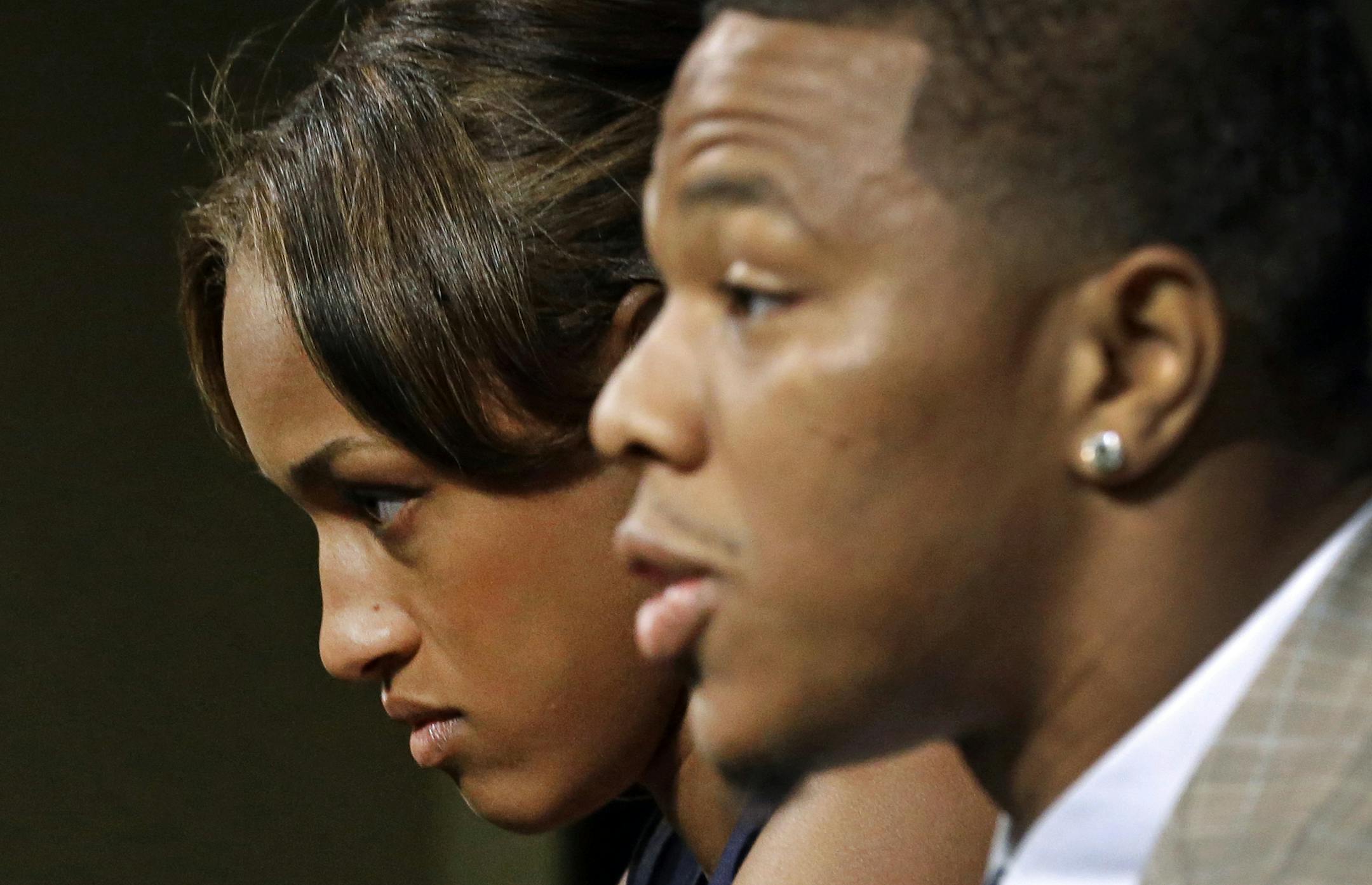 FILE - In this May 23, 2014, file photo, Janay Rice, left, looks on as her husband, Baltimore Ravens running back Ray Rice, speaks to the media during an news conference in Owings Mills, Md. Rice starts his two-game suspension Saturday, Aug. 30, 2014, missing the Ravensí home opener against Cincinnati and a key AFC North showdown in Pittsburgh. (AP Photo/Patrick Semansky, File)