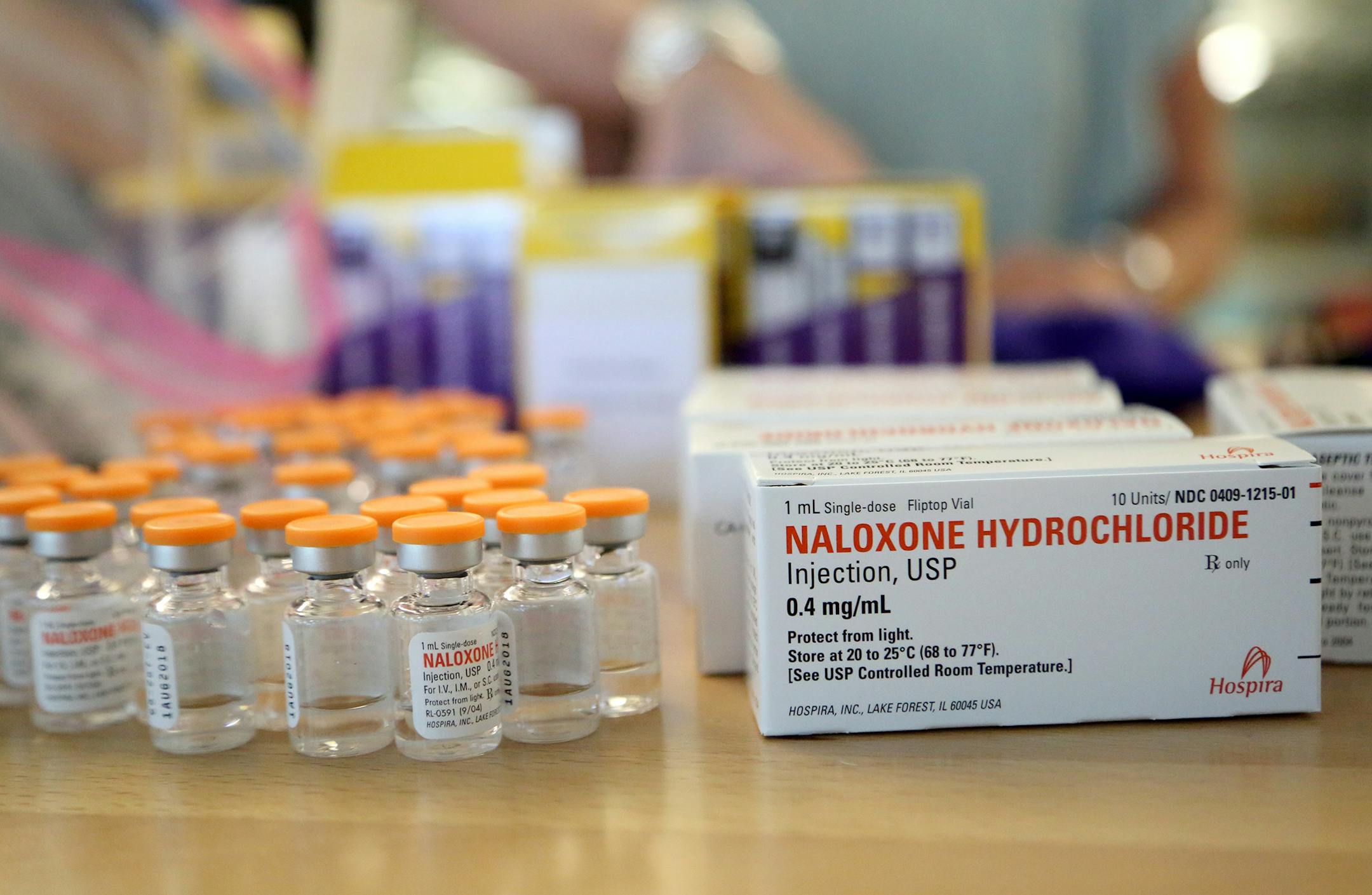 Volunteers put together naloxone kits at the nonprofit headquarters for the Steve Rummler Hope Network.