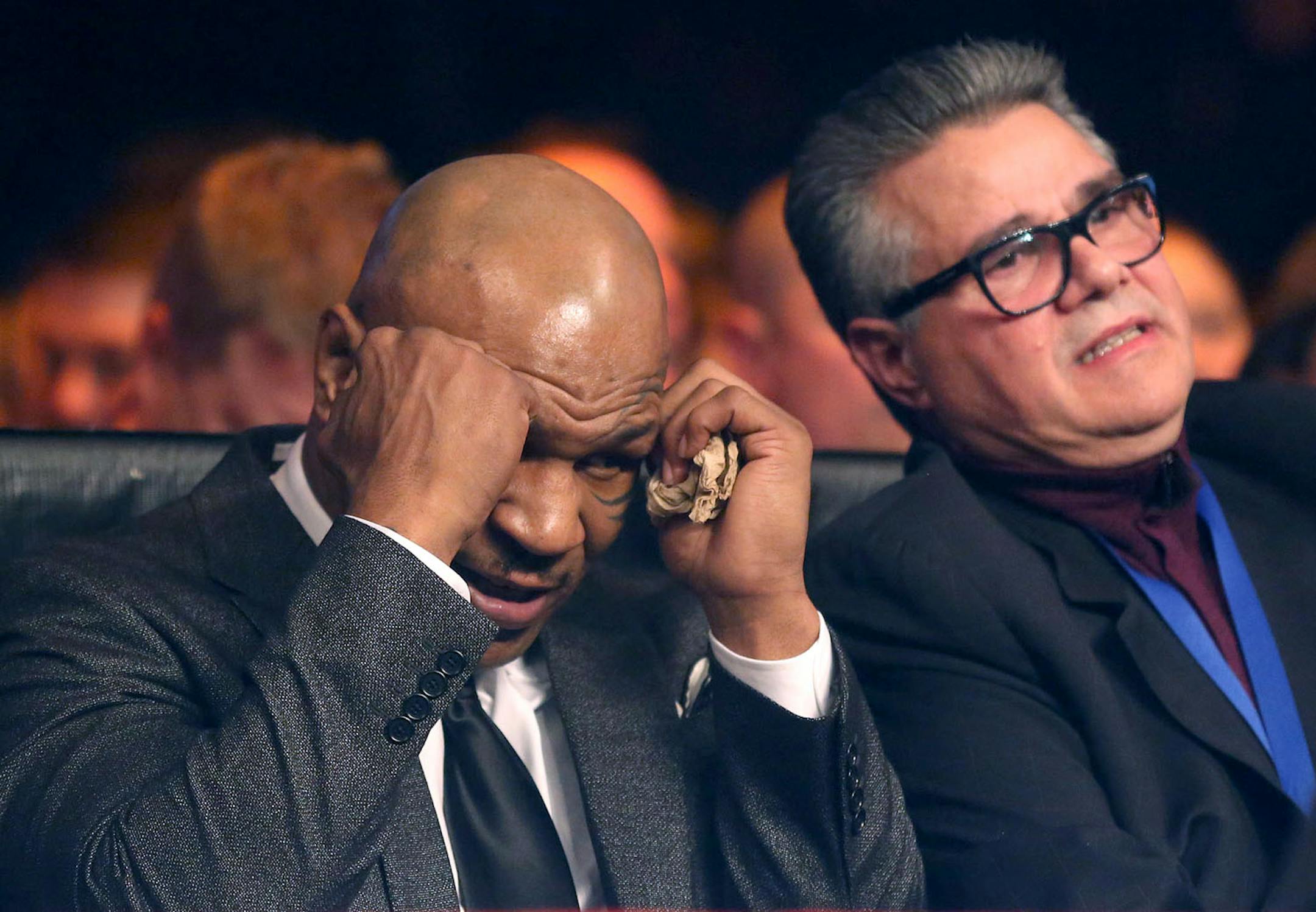 Ex-boxer Mike Tyson covered up as he talked about the bout of Ossie Duran aka - The Ghanaian Gladiator and USBA Middleweight Champion Caleb Truax, of Osseo, Minnesota with his co-promoter Louie DeCubas during the semi final fight at Target Center in Minneapolis Friday, January 3, 2014. The bout ended in a tie 95-95. ] (KYNDELL HARKNESS/STAR TRIBUNE) kyndell.harkness@startribune.com