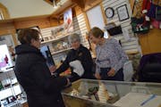 Crafters Gerri Broome, Nancy Benson and Lorraine Purcell at the counter of The Landing Shop in Minnetonka.