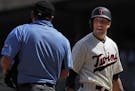 The Minnesota Twins' Jason Castro is not pleased with his called third strike against the Toronto Blue Jays at Target Field in Minneapolis on Wednesda