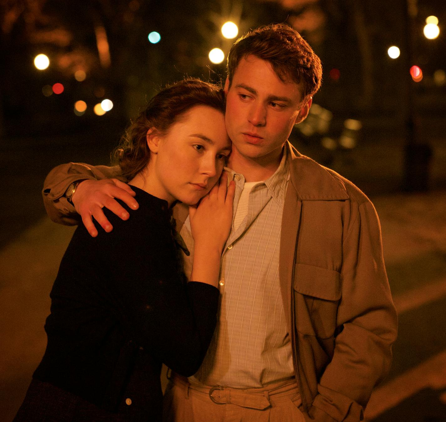 This photo provided by Fox Searchlight shows, Saoirse Ronan, left, as Eilis Lacey and Emory Cohen as Tony, in a scene from the film, "Brooklyn." The movie opens in U.S. theaters on Nov. 4, 2015. (Kerry Brown/Fox Searchlight via AP)