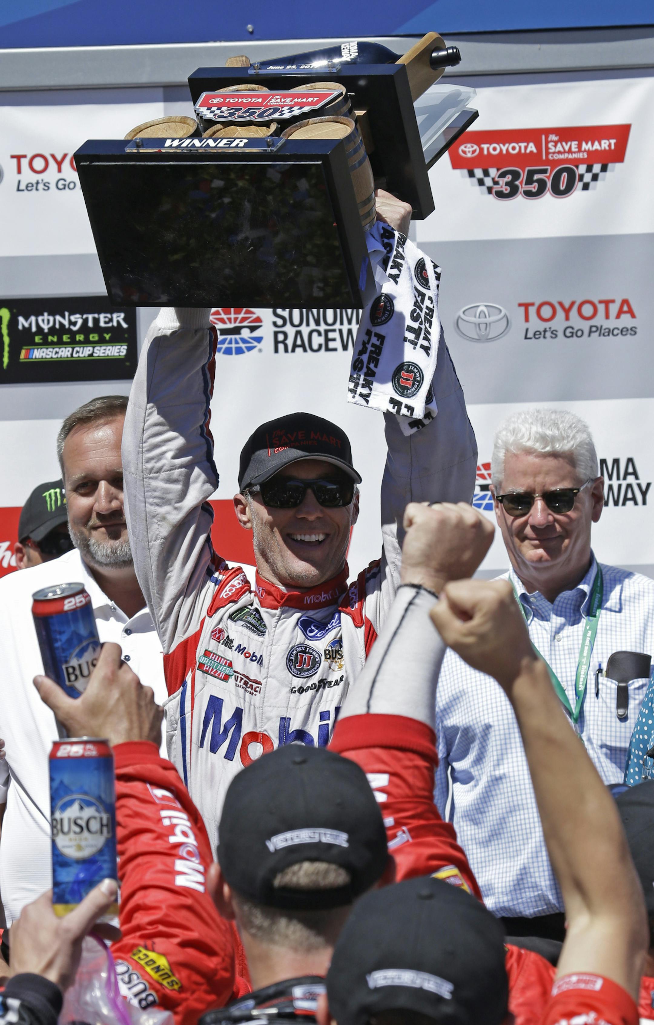 Kevin Harvick held the trophy after winning the NASCAR Sprint Cup Series race Sunday in Sonoma, Calif.