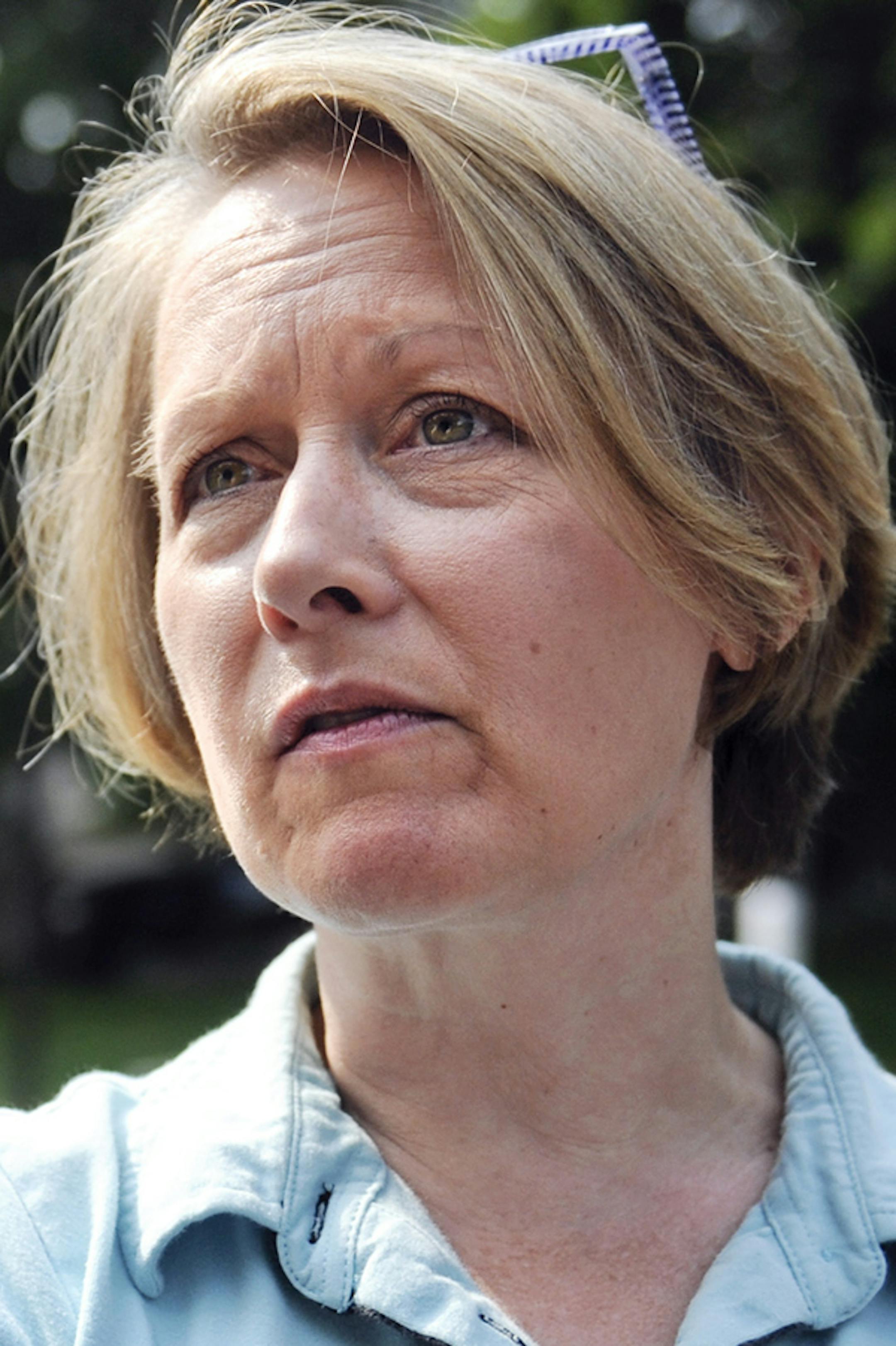 Rep. Jenifer Loon (R), of Eden Prairie canvases her neighborhood as she prepares for the Republican primary in Eden Prairie, Minn. Wednesday, July 30, 2014. Loon faces challenger Shelia Kihne in the Republican primary election on August 12. (AP Photo/Craig Lassig) ORG XMIT: MIN2014080516124440