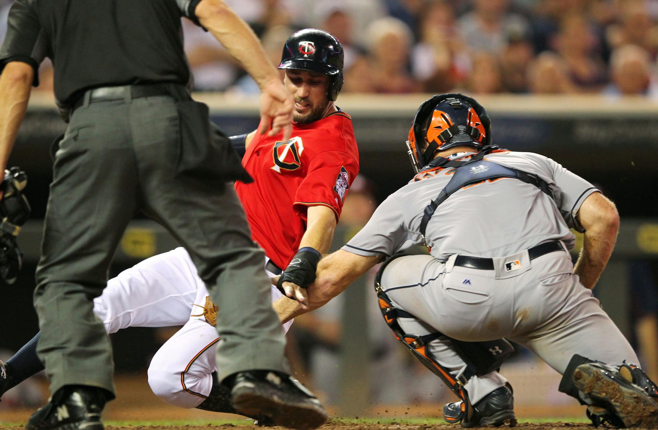 Astros catcher Evan Gattis tagged out the Twins' Trevor Plouffe at home in the seventh inning Tuesday in Houston's 7-5 victory.