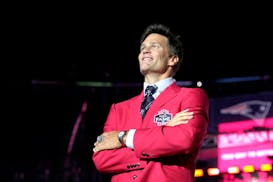 Former New England Patriots quarterback Tom Brady looks into the crowd at the conclusion of Patriots Hall of Fame induction ceremonies for Brady at Gi