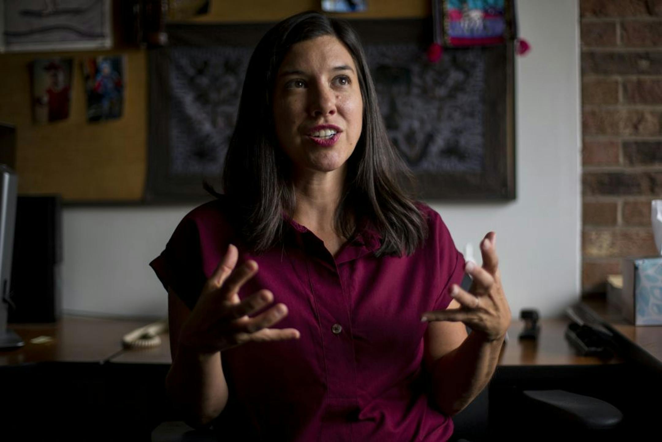 Dr. Jillian Peterson poses for a portrait in her office..