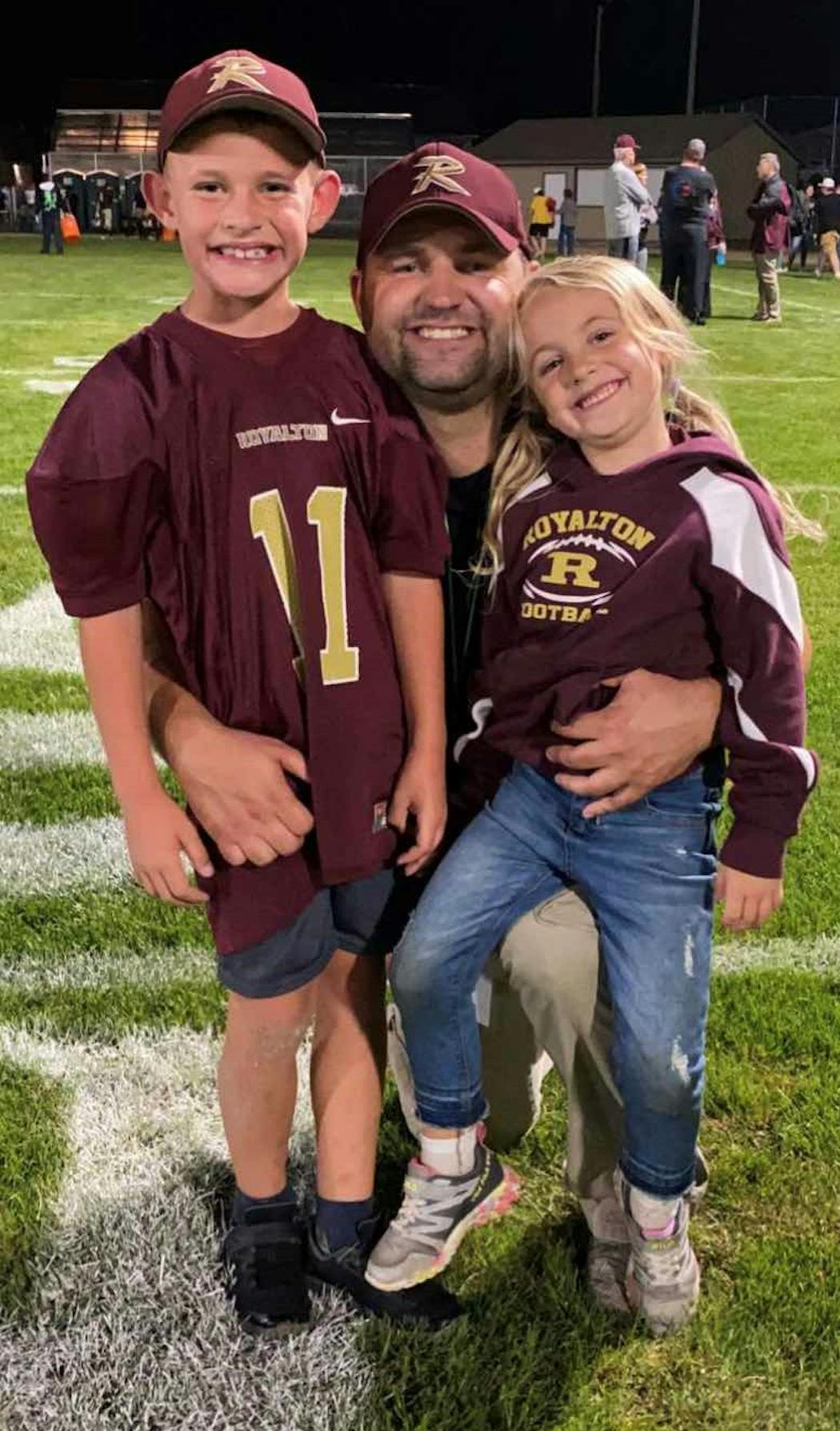 Nick Lanners with his children, Emery and Grayson. Grayson is wearing the No. 11 his dad wore for Royalton.