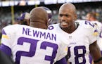 Minnesota Vikings running back Adrian Peterson (28) congratulated cornerback Terence Newman (23) on his forth quarter interception at the Oakland Coli