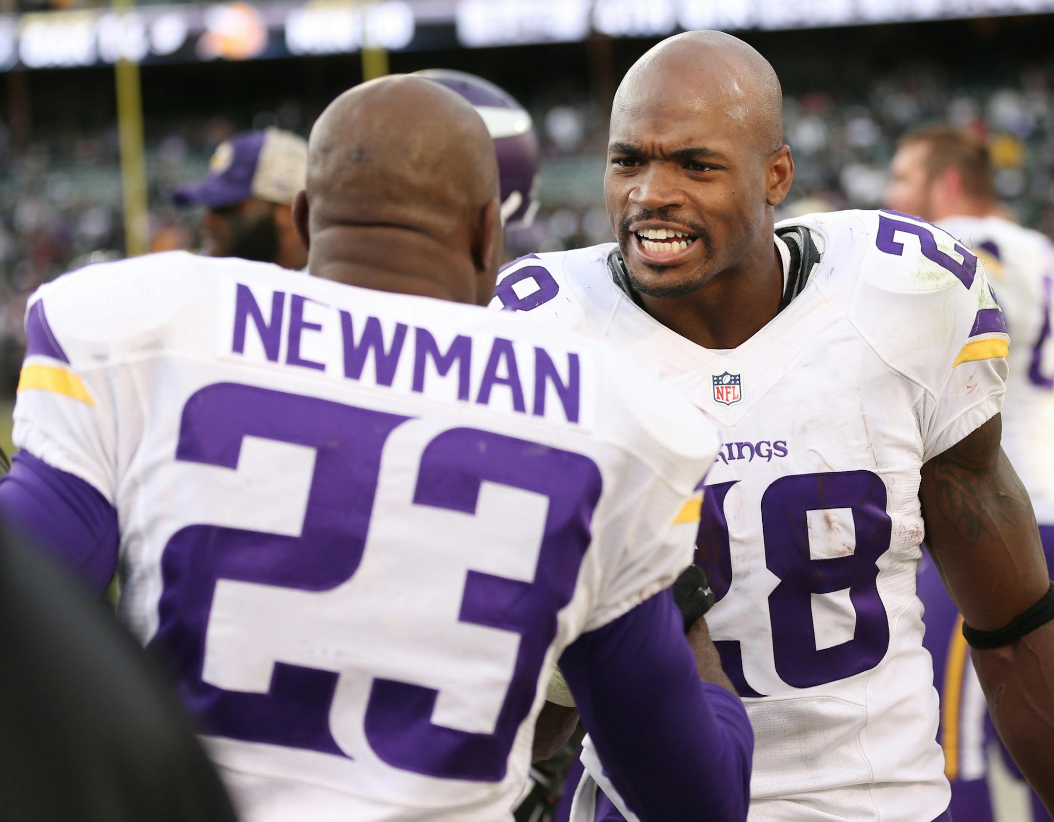 Minnesota Vikings running back Adrian Peterson (28) congratulated cornerback Terence Newman (23) on his forth quarter interception at the Oakland Coliseum Sunday November 15, 2015 in Oakland, CA.] The Minnesota Vikings beat at the Oakland Raiders 30-14 in the Coliseum. Jerry Holt/ Jerry.Holt@Startribune.com