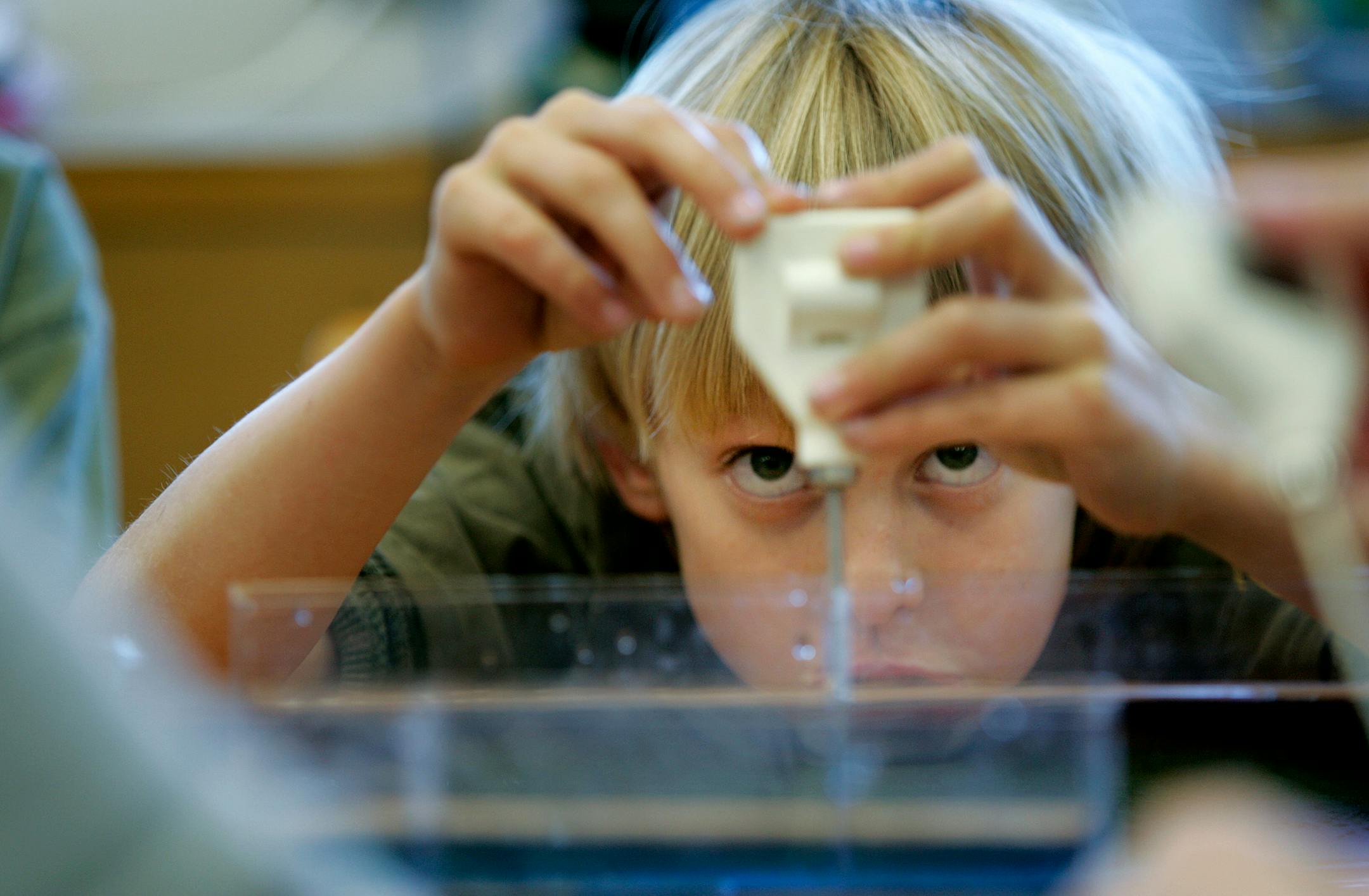 Fourth-grader Jacob Lundquist took a careful water reading during a science class Tuesday at St. Anthony Park Elementary School.
