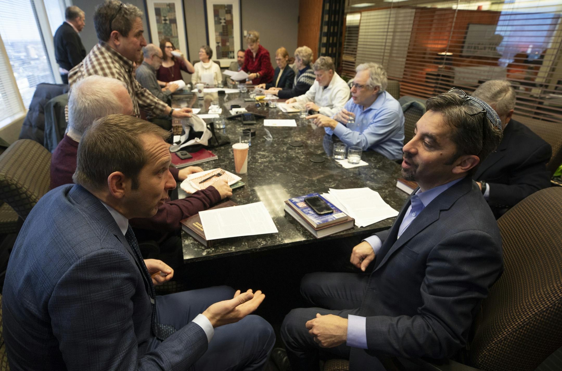 Adam Garen left talked with Rabbi Adam Spilker of Mount Zion during a weekly discussion of the Torah at Henson & Efron Law firm Thursday January 10, 2019 in Minneapolis, MN.] Jerry Holt • Jerry.holt@startribune.com