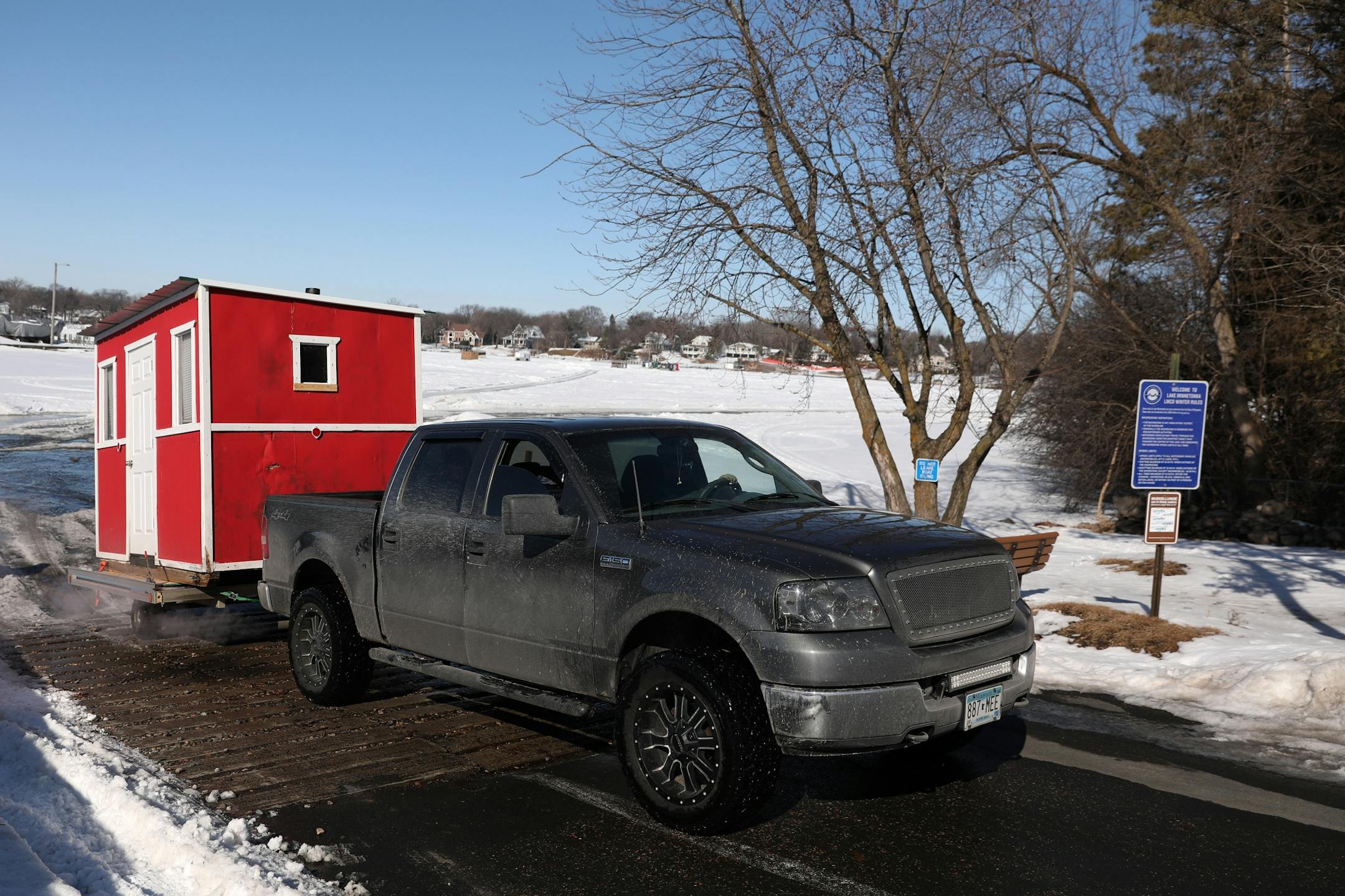 Anglers removed their ice fishing shelter Thursday at Lake Minnetonka.
